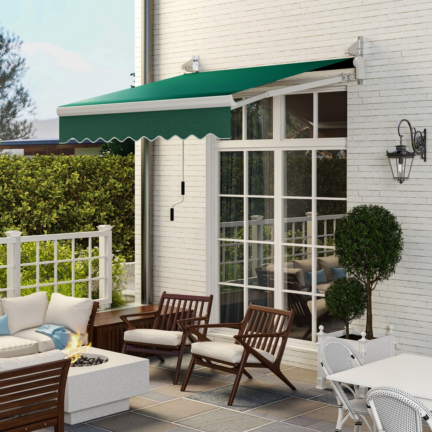 Dark green retractable awning with scalloped edge over a patio window
