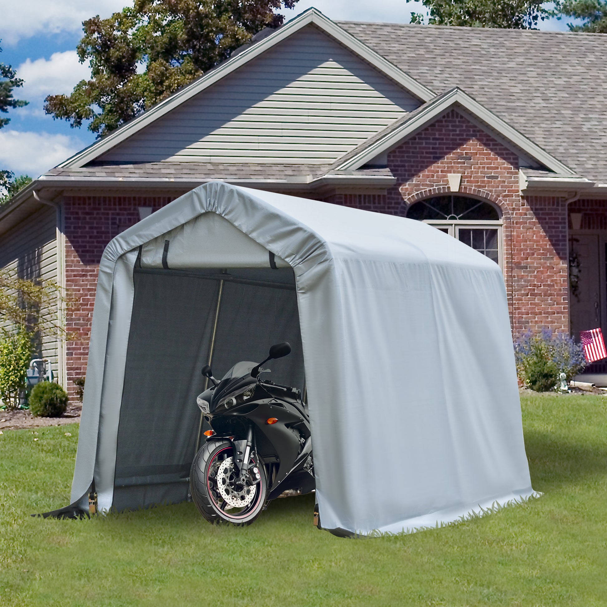 Gray portable garage with black sport motorcycle parked inside
