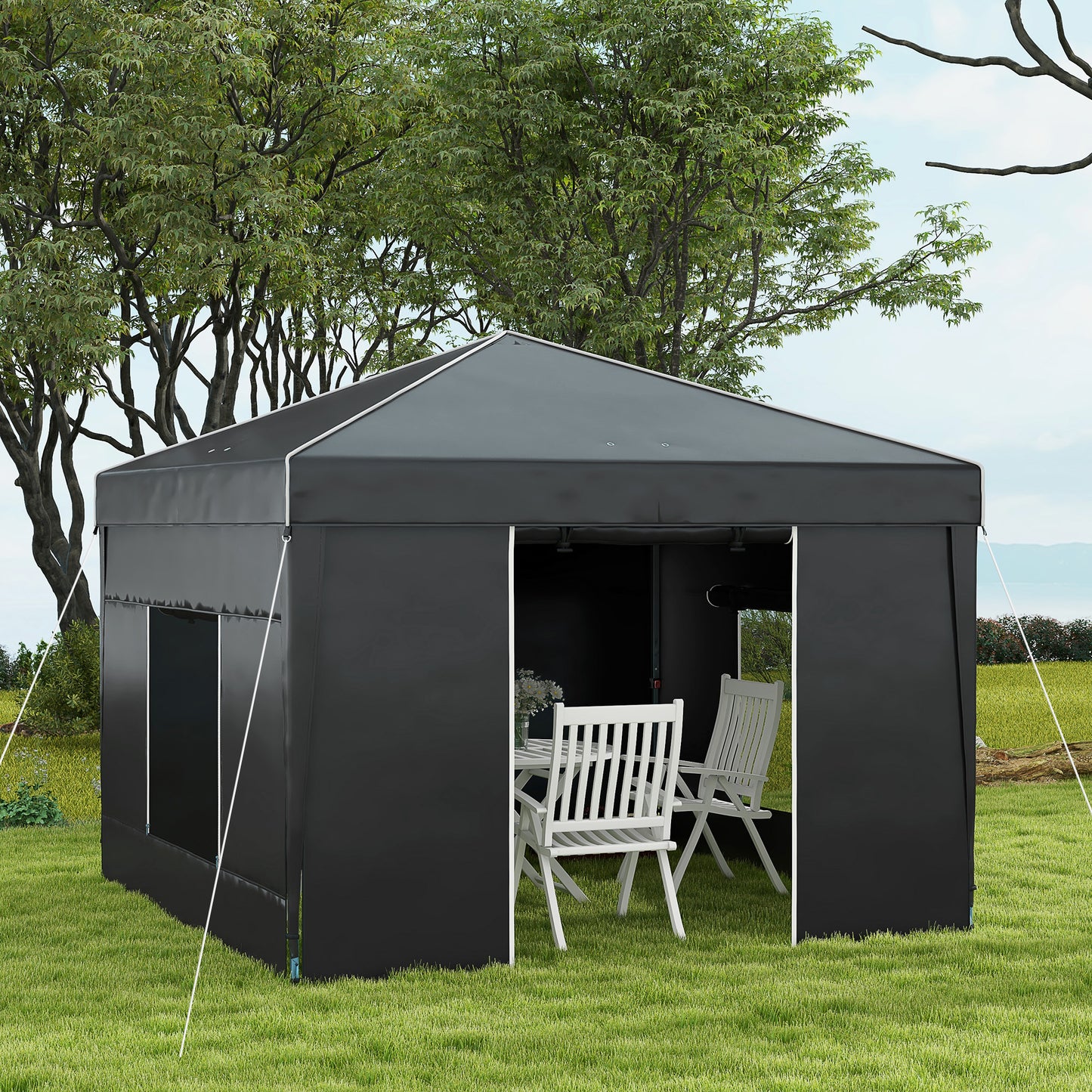 Dark grey popup gazebo with white trim set up on a grassy lawn with trees