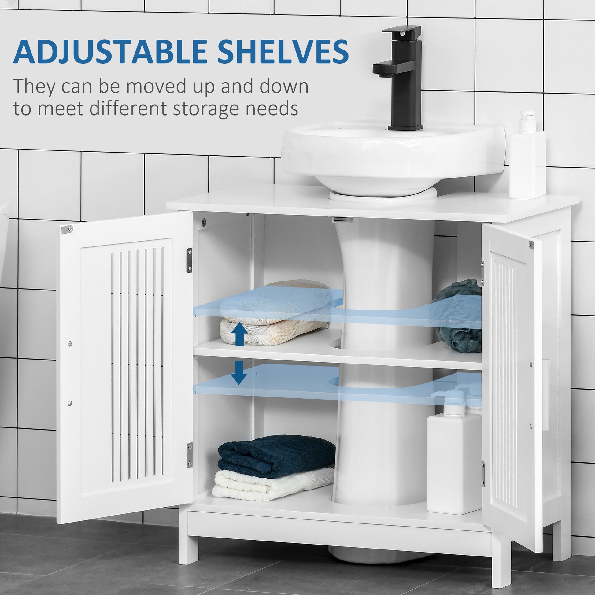 White bathroom vanity with adjustable shelves holding folded towels and bath pouf