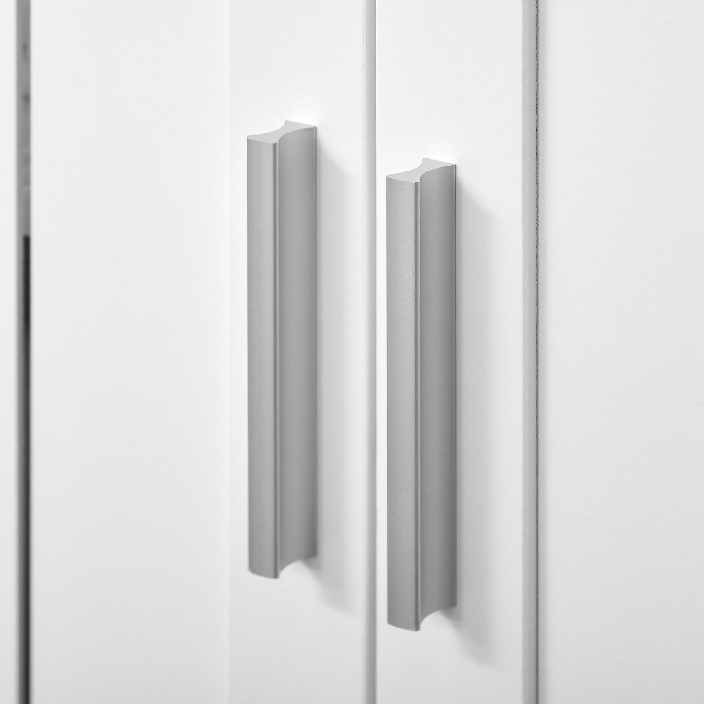 Sleek silver cabinet pull with a modern minimalist design for kitchen drawers