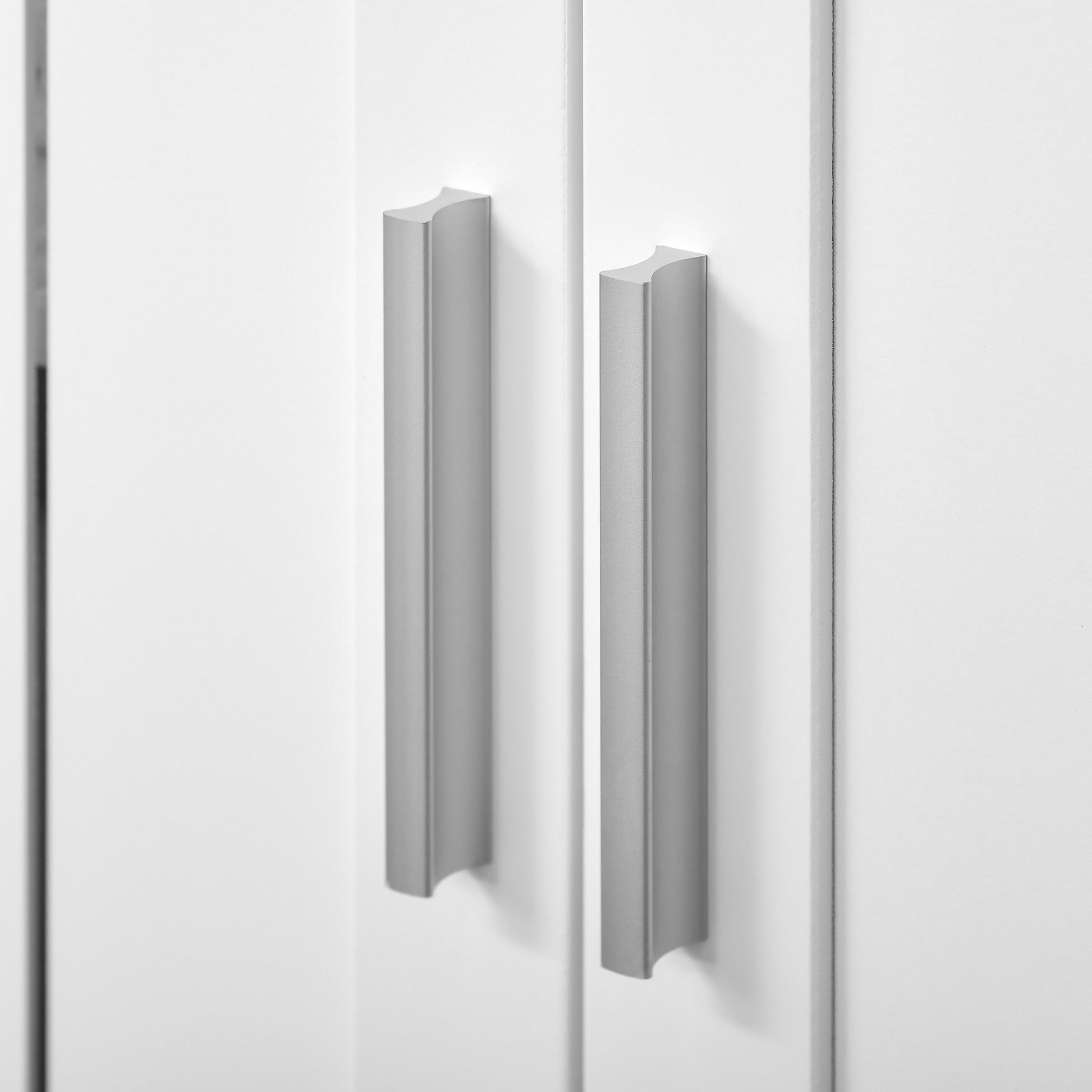Sleek silver cabinet pull with a modern minimalist design for kitchen drawers
