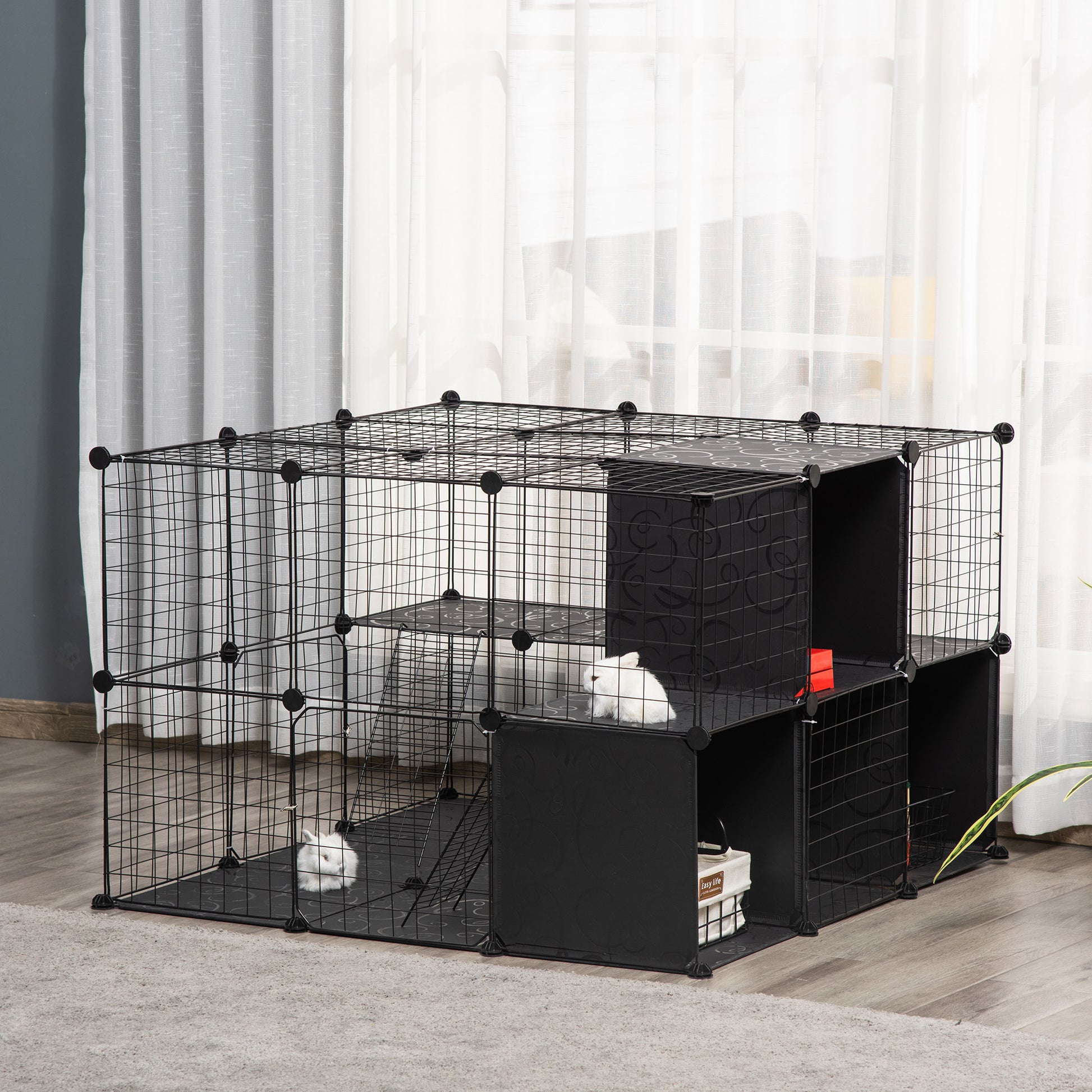 Black wire modular habitat with multiple levels for small pets like rabbits