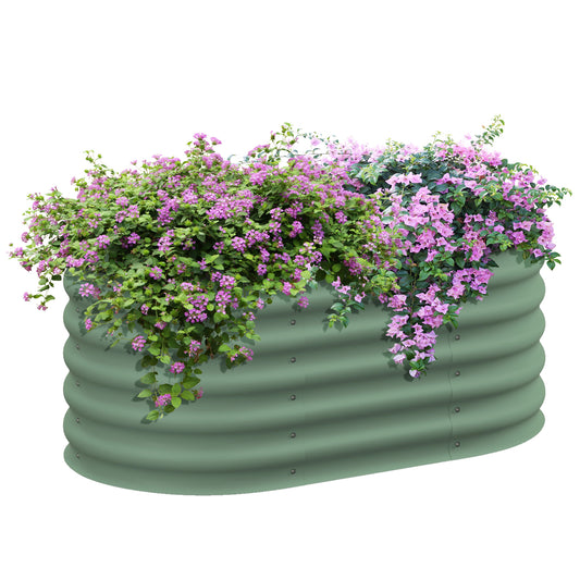 Sage green corrugated metal raised garden bed overflowing with pink bougainvillea and green foliage
