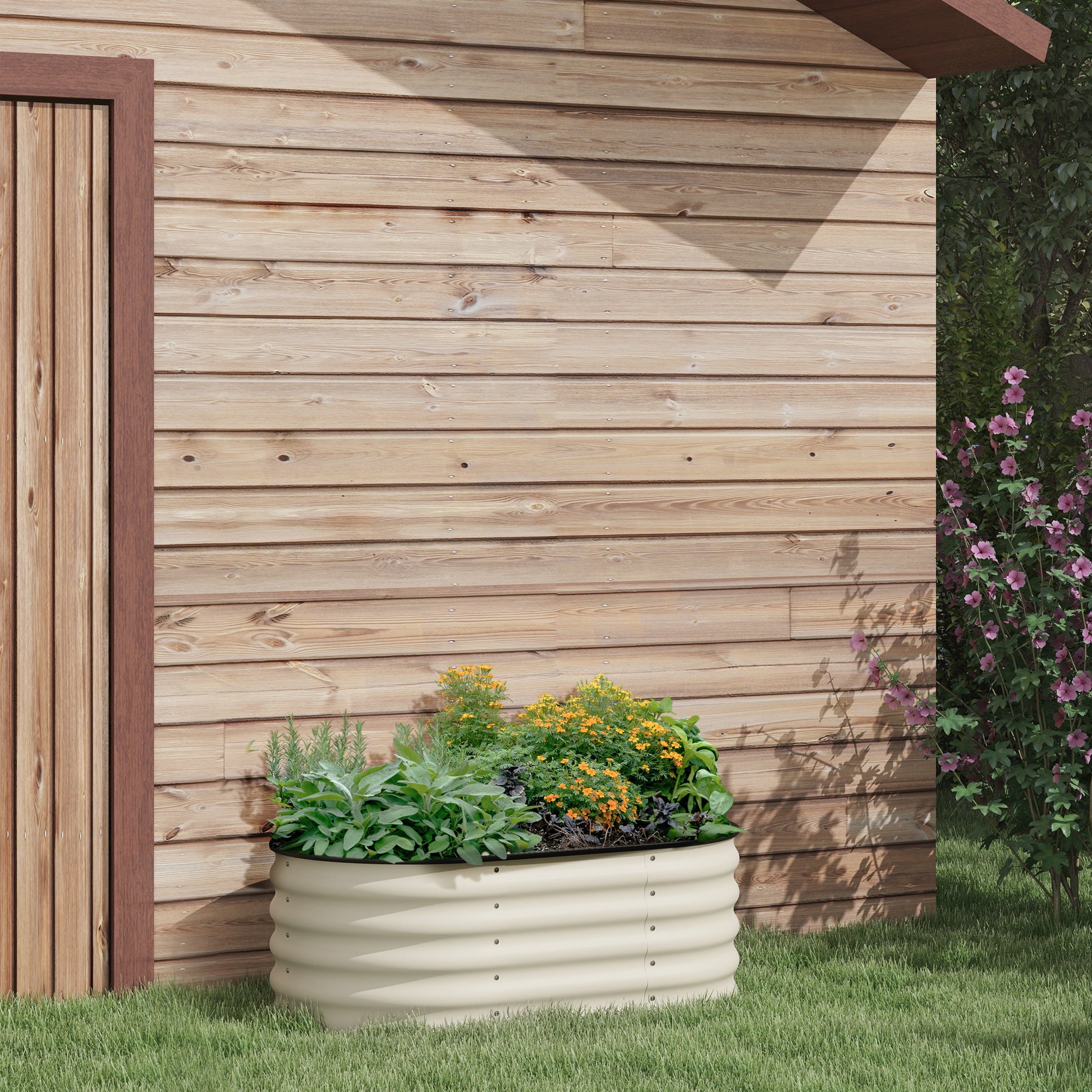 Beige corrugated metal raised garden bed with herbs and flowers