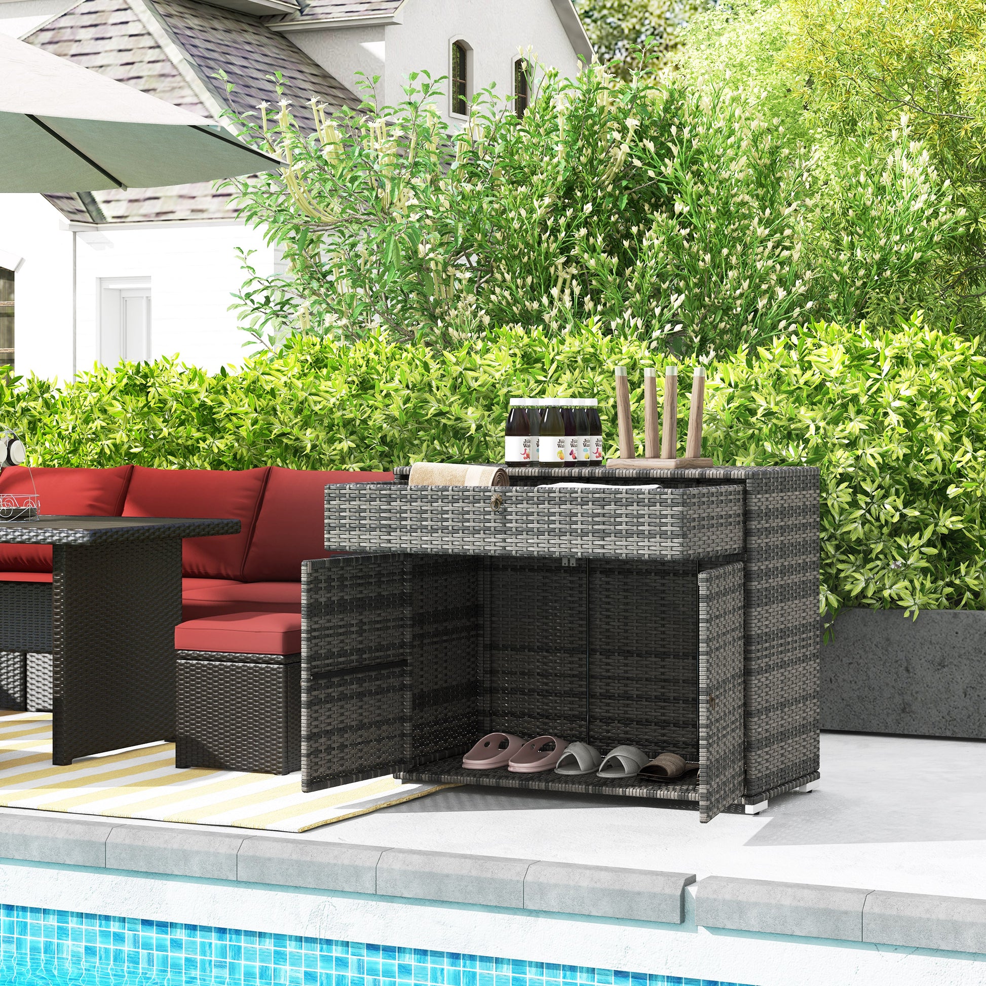 Grey wicker outdoor storage cabinet with open doors storing sandals
