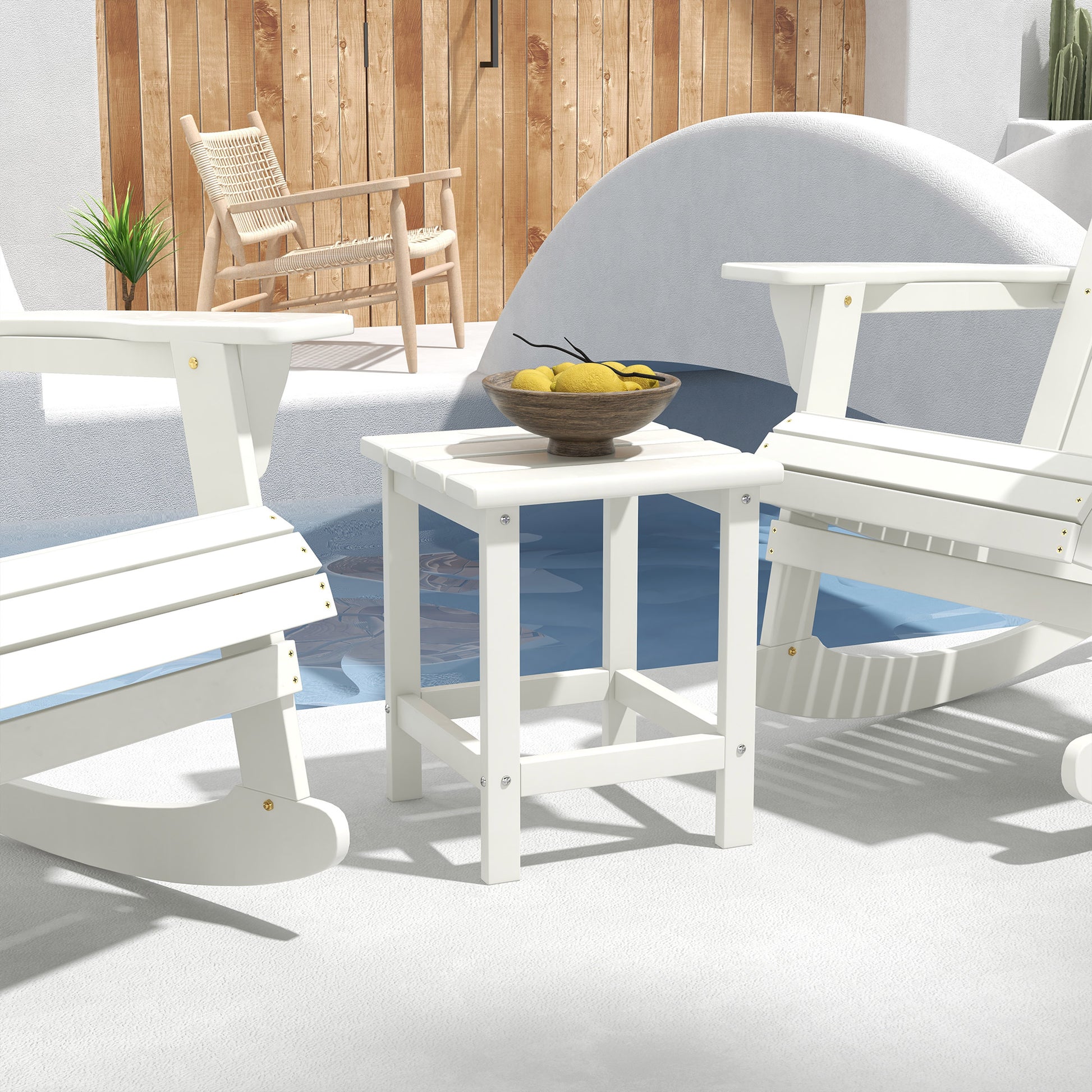 White Adirondack rocking chair made from durable weatherresistant material for outdoor relaxation