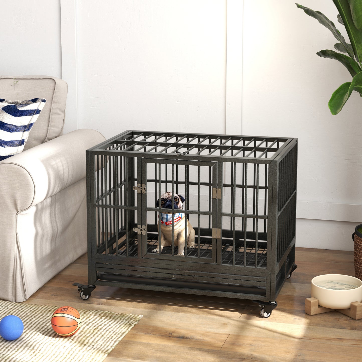 Durable metal dog crate with rolling wheels providing secure containment for pets