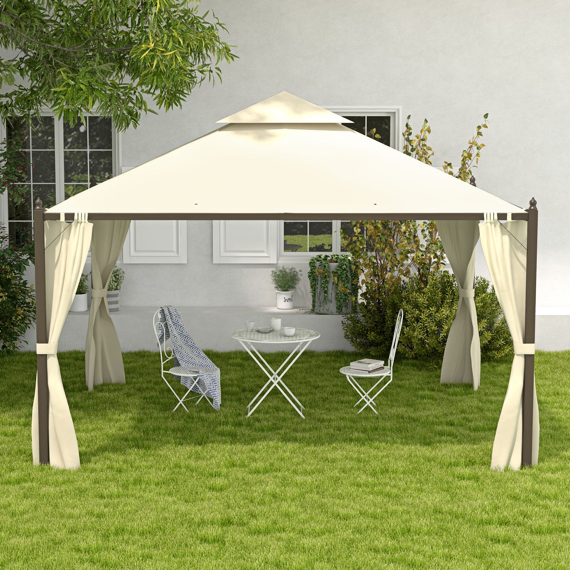 Creamcolored outdoor gazebo with brown frame and curtains two chairs and a table