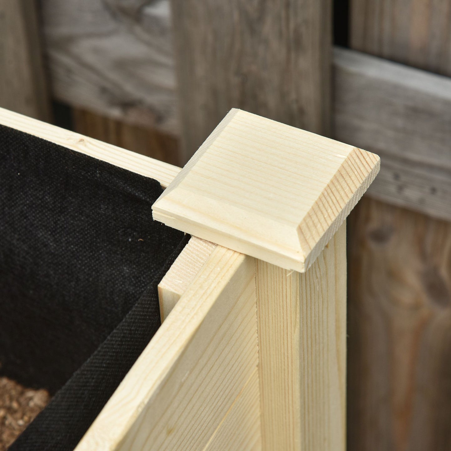 Corner cap detail on unfinished pine raised garden bed kit