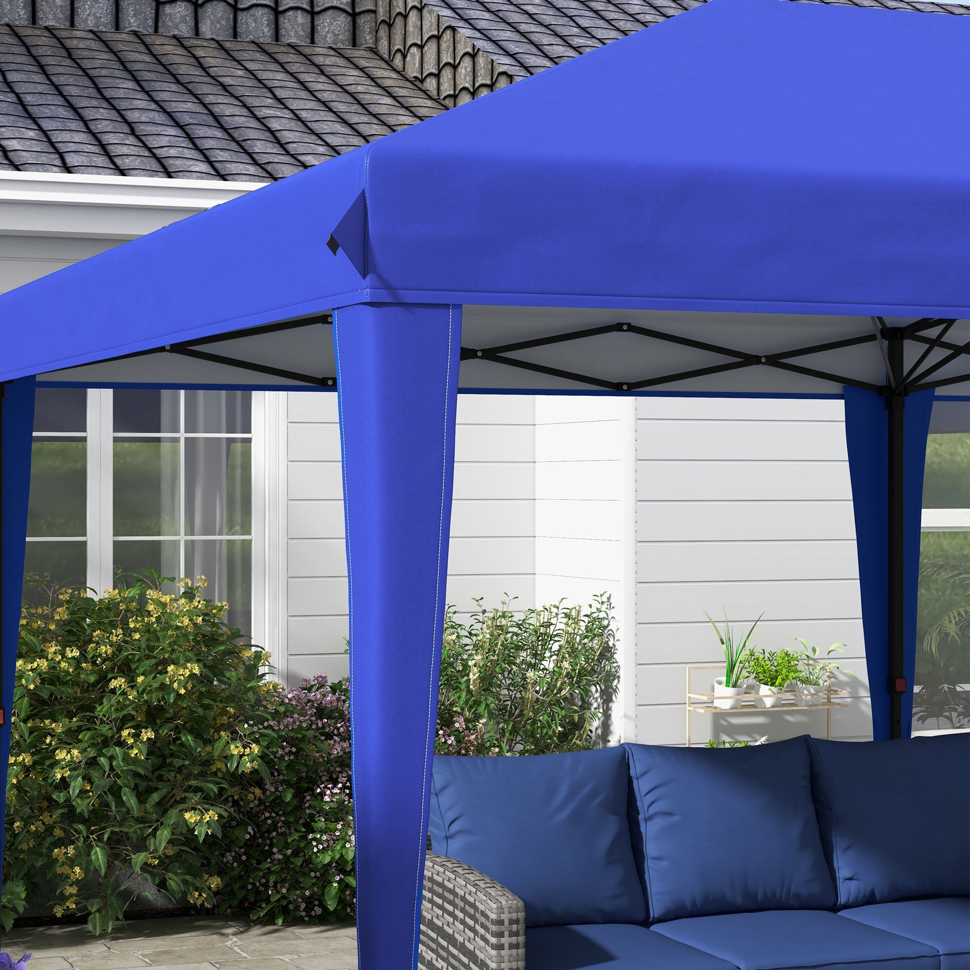 Royal blue fabric canopy tent providing outdoor shade over a patio seating area