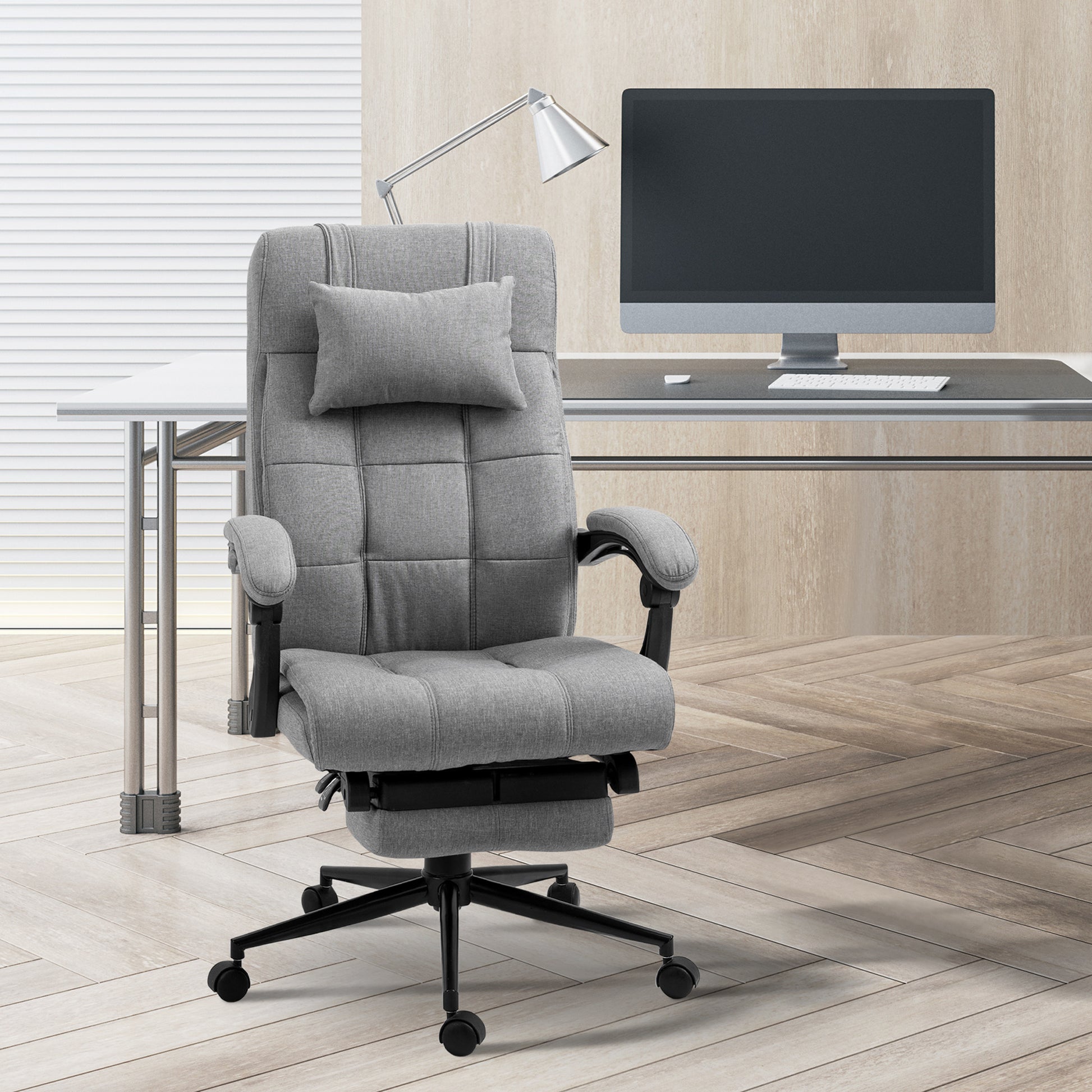 Grey fabric executive chair with adjustable headrest and footrest
