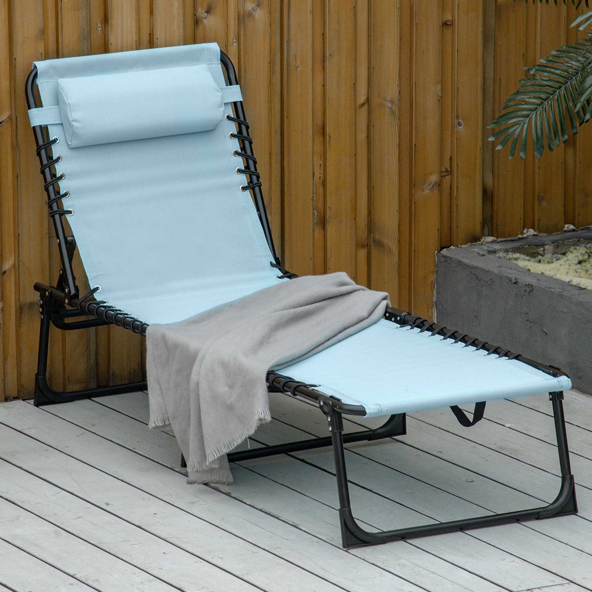Light blue fabric lounge chair with black metal frame and adjustable pillow