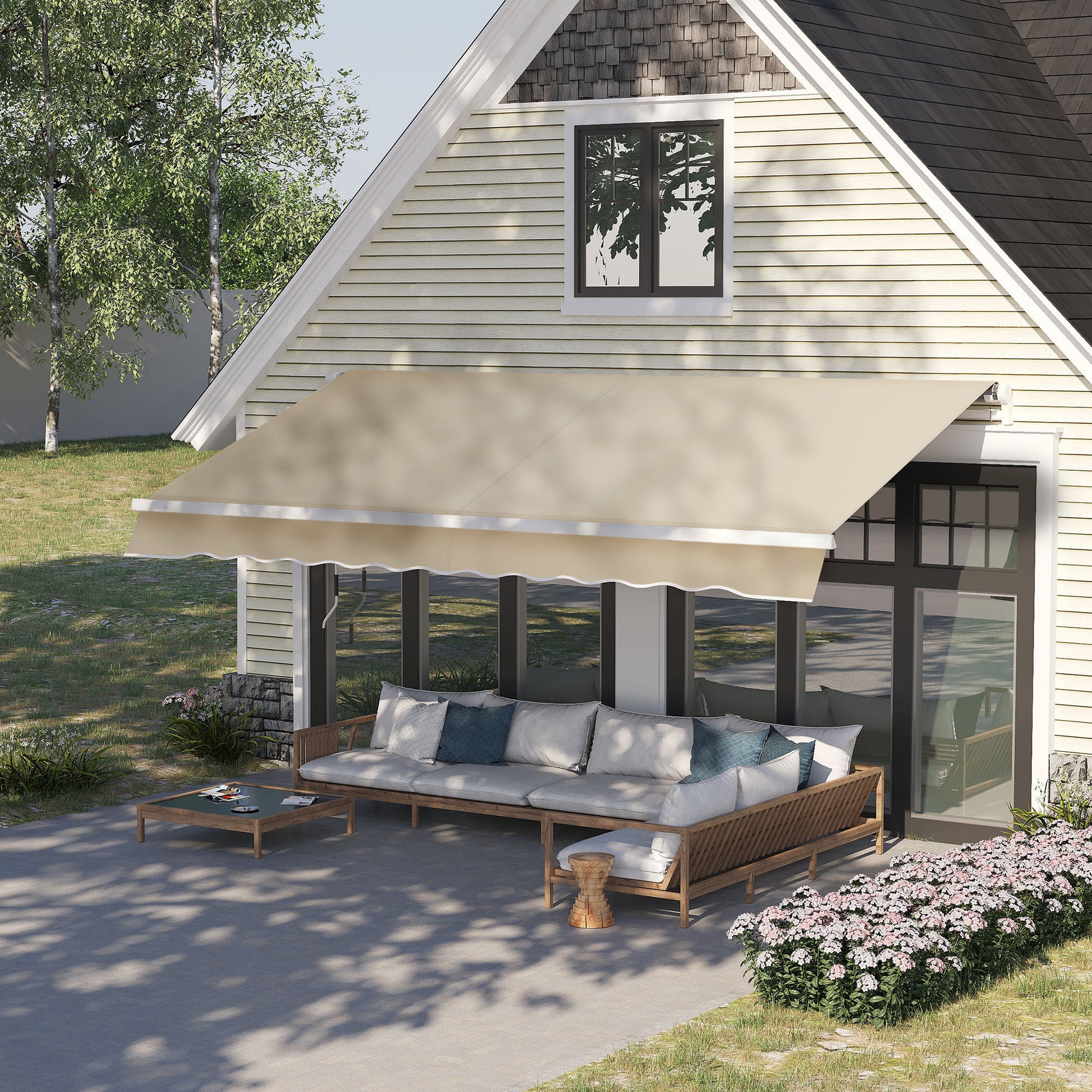 Expansive beige retractable patio awning providing shade over a modern outdoor sectional sofa