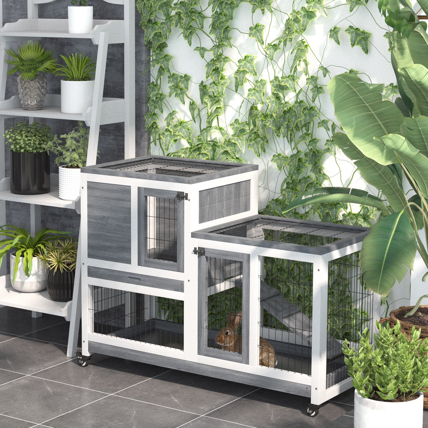 Twotier gray and white rabbit hutch with wire mesh doors and a brown rabbit inside