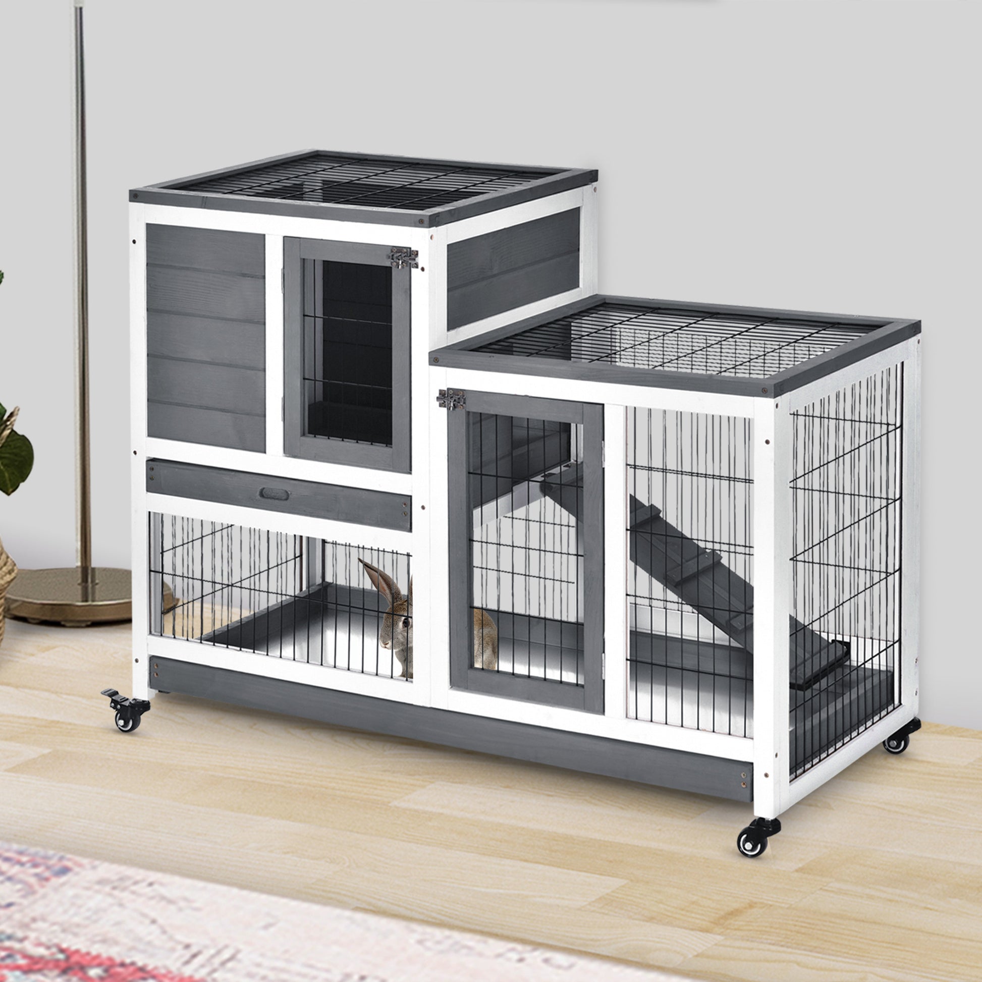 Twotier grey and white wooden rabbit hutch with ramp and wheels for small pets