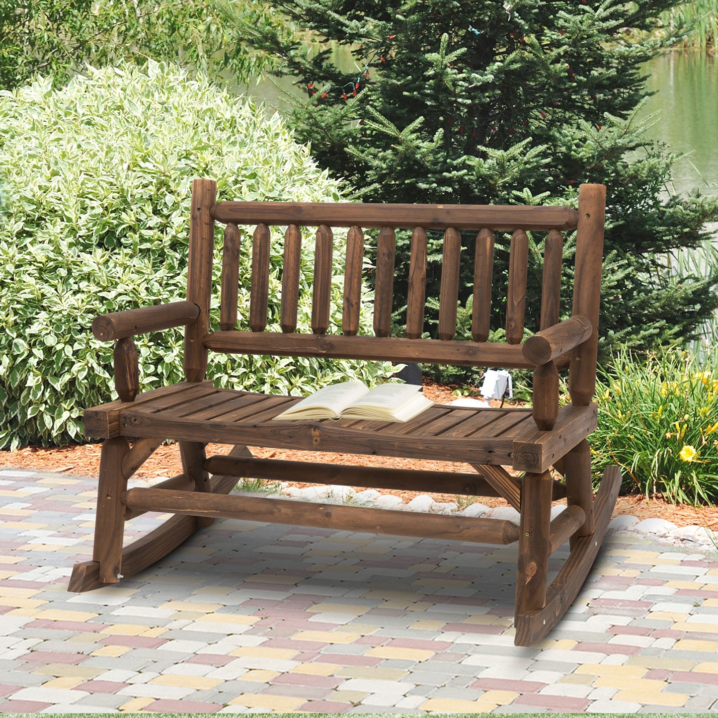 Rustic dark wood rocking bench with an open book perfect for outdoor seating