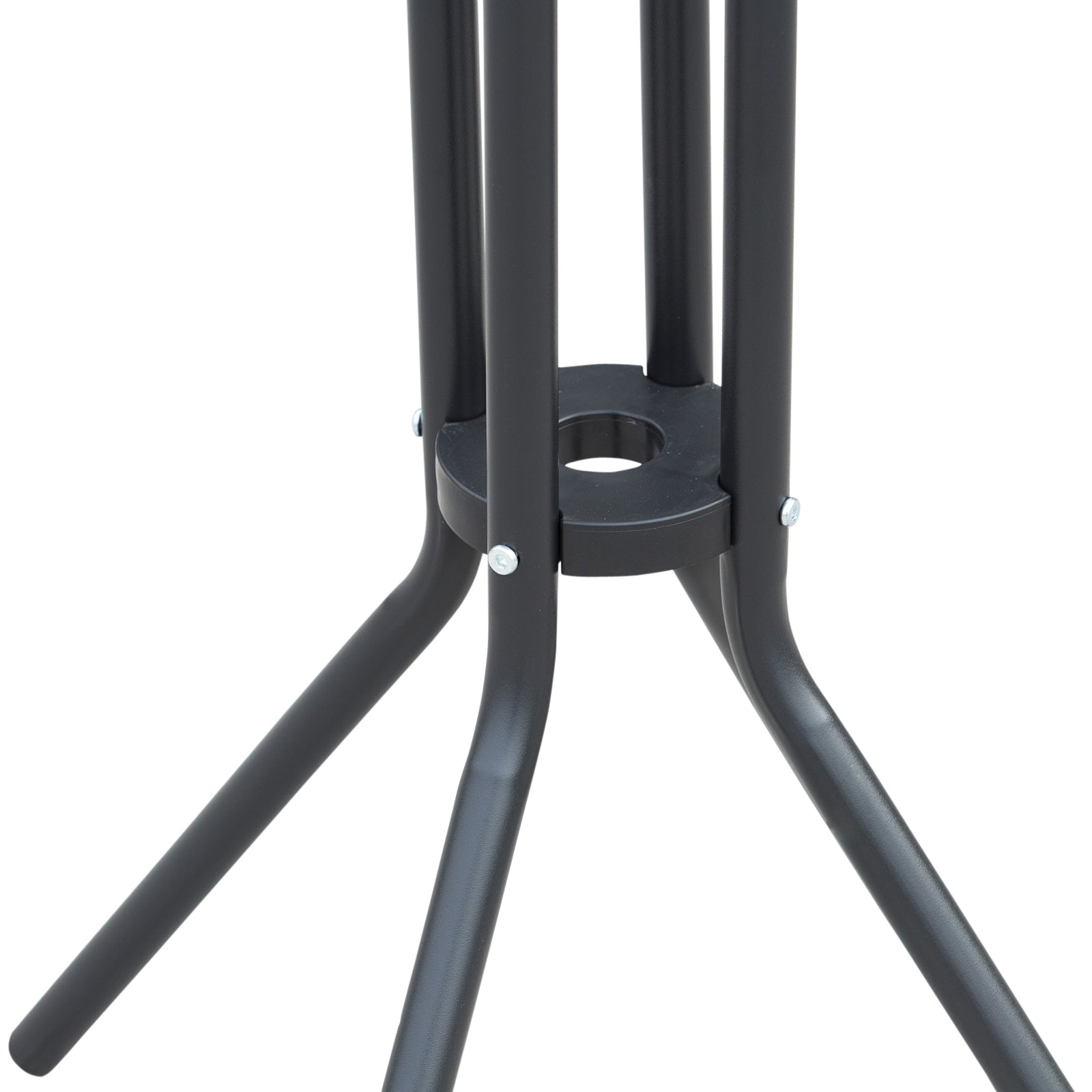 Close up of black metal table legs with a circular support