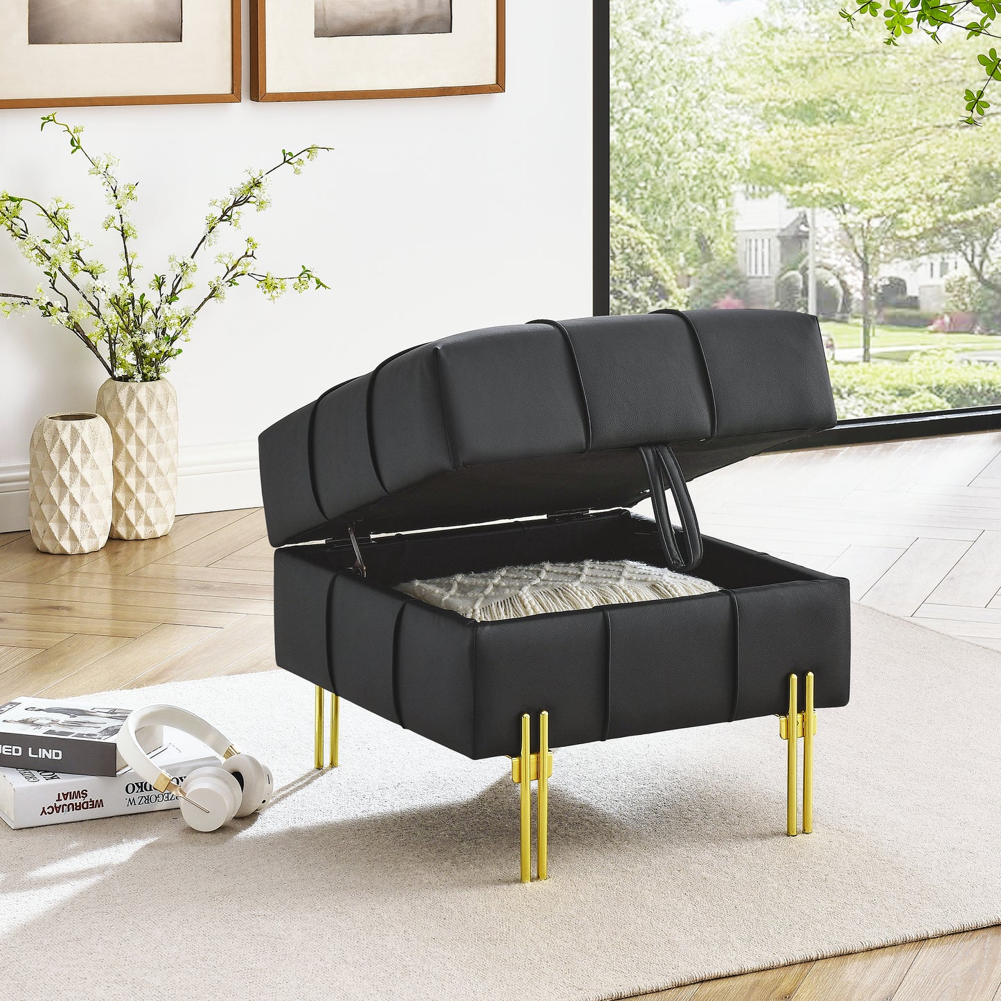 Black tufted storage ottoman with gold legs showcasing hidden storage