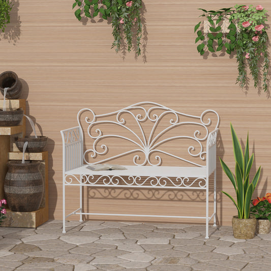 White wrought iron garden bench with intricate scrollwork details