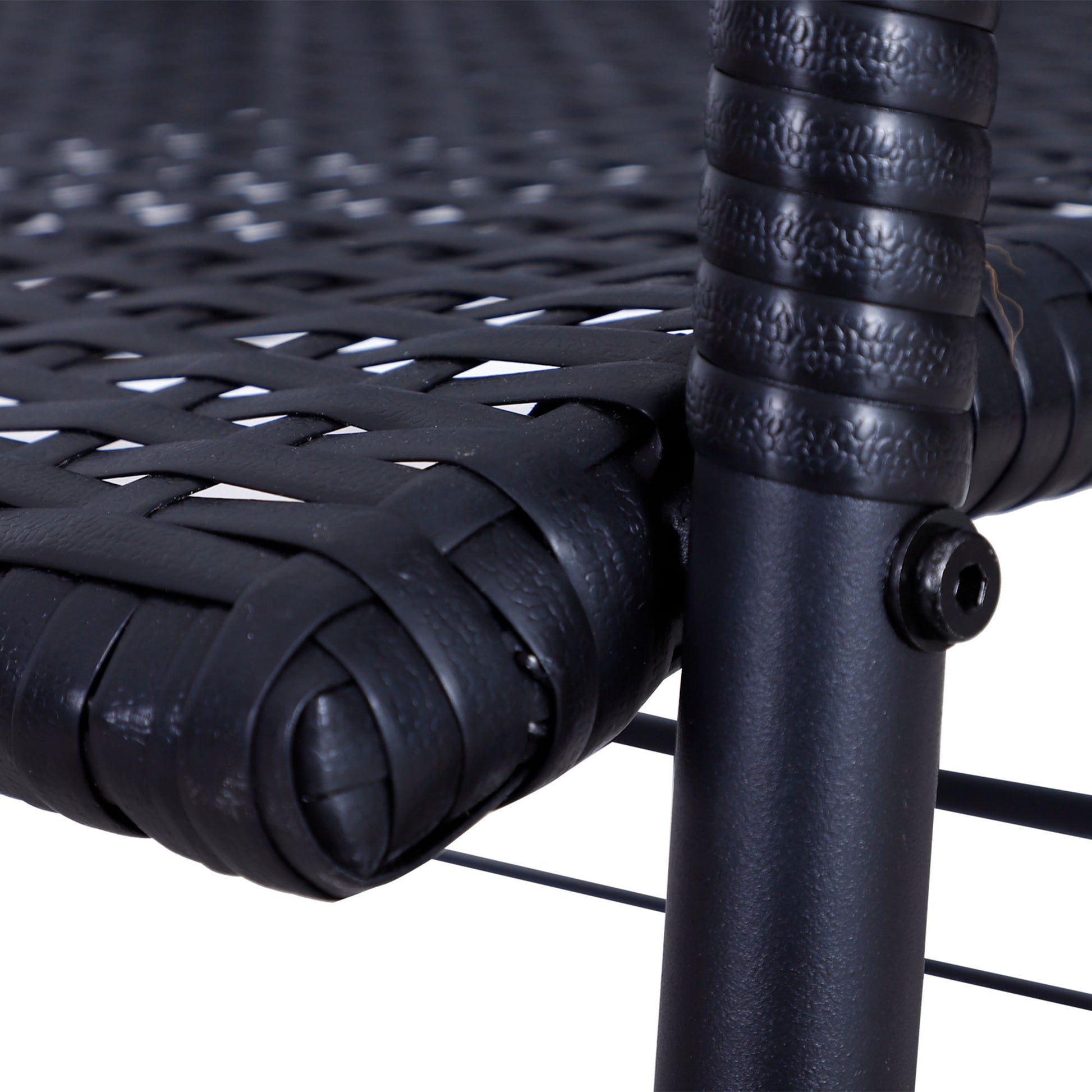 Black wicker furniture detail woven seat closeup on white background