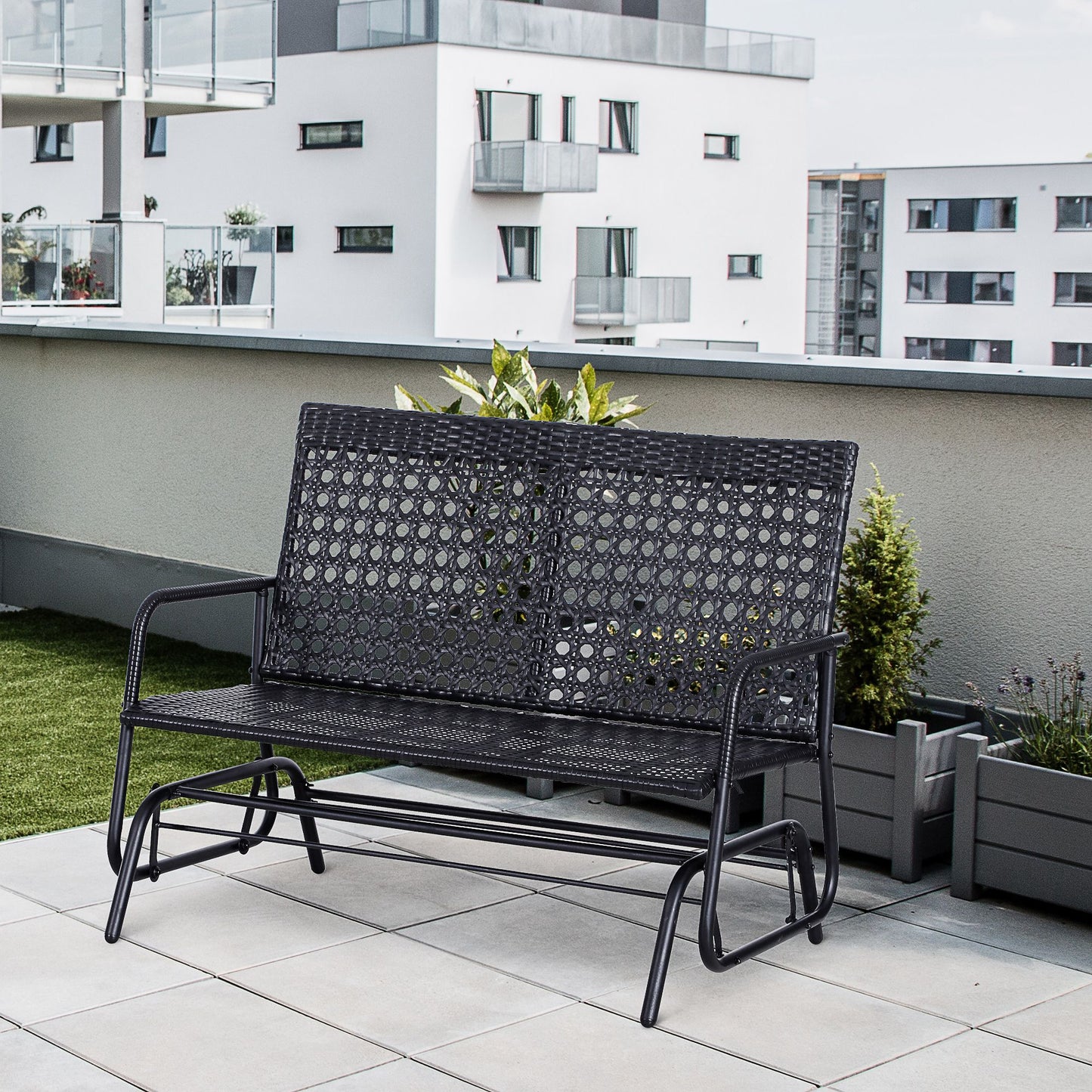Black wicker patio glider bench with metal frame perfect for outdoor relaxation
