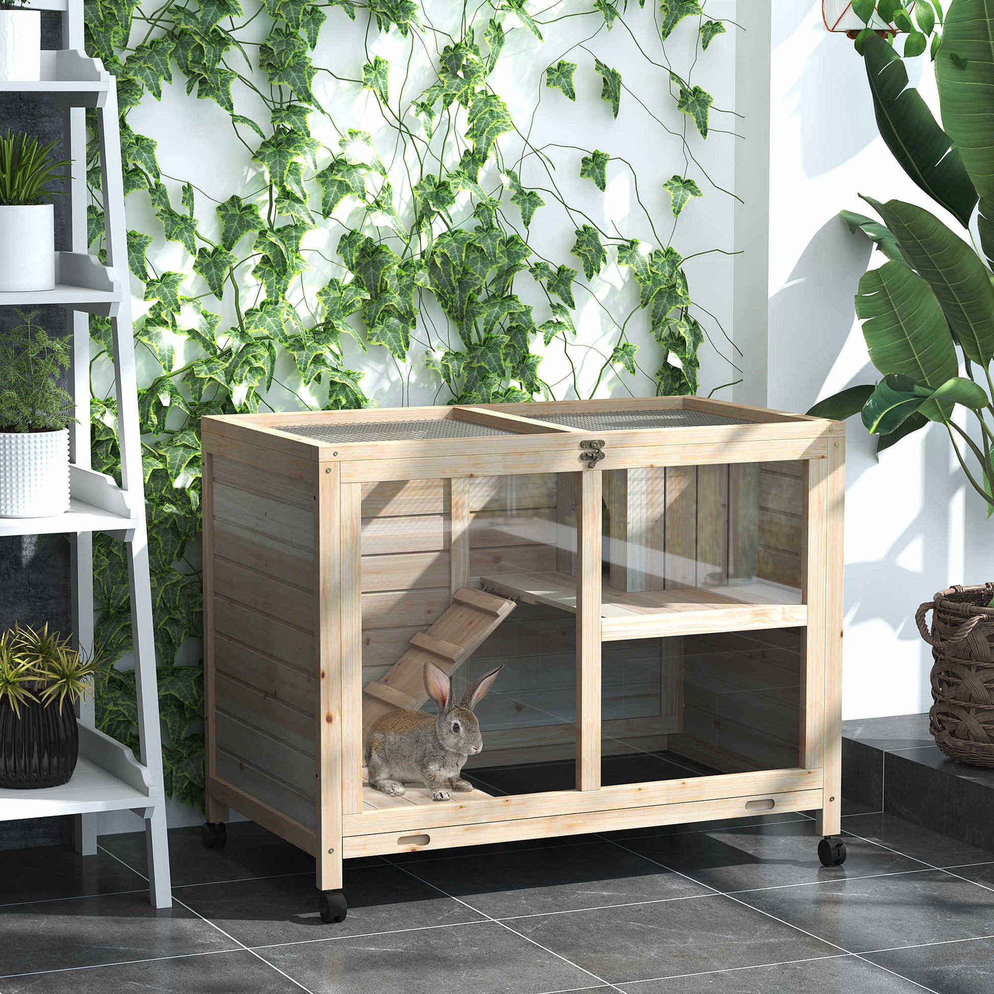 Wooden twotier pet hutch with metal mesh roof and a rabbit inside