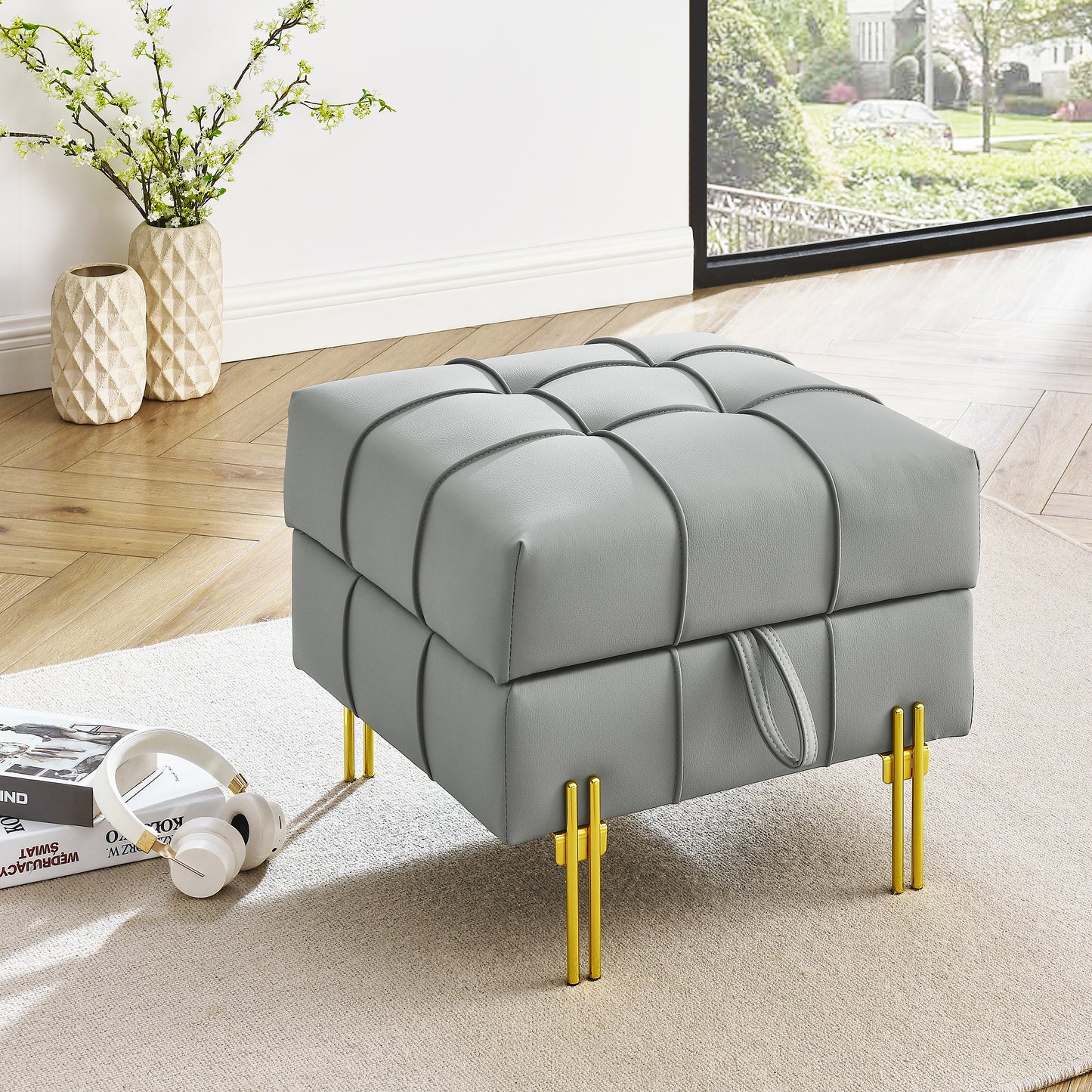 Grey faux leather tufted ottoman with gold legs ideal for living room decor