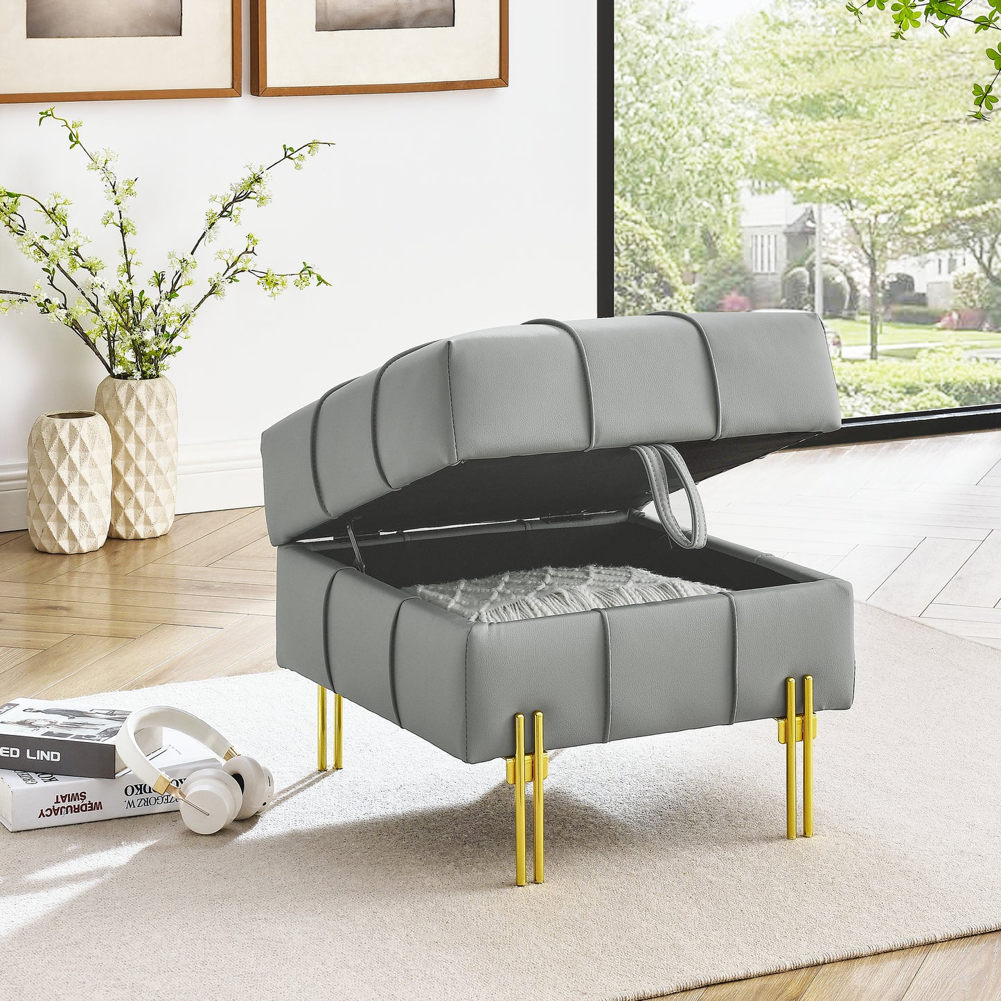 Grey storage ottoman with tufted faux leather and gold legs