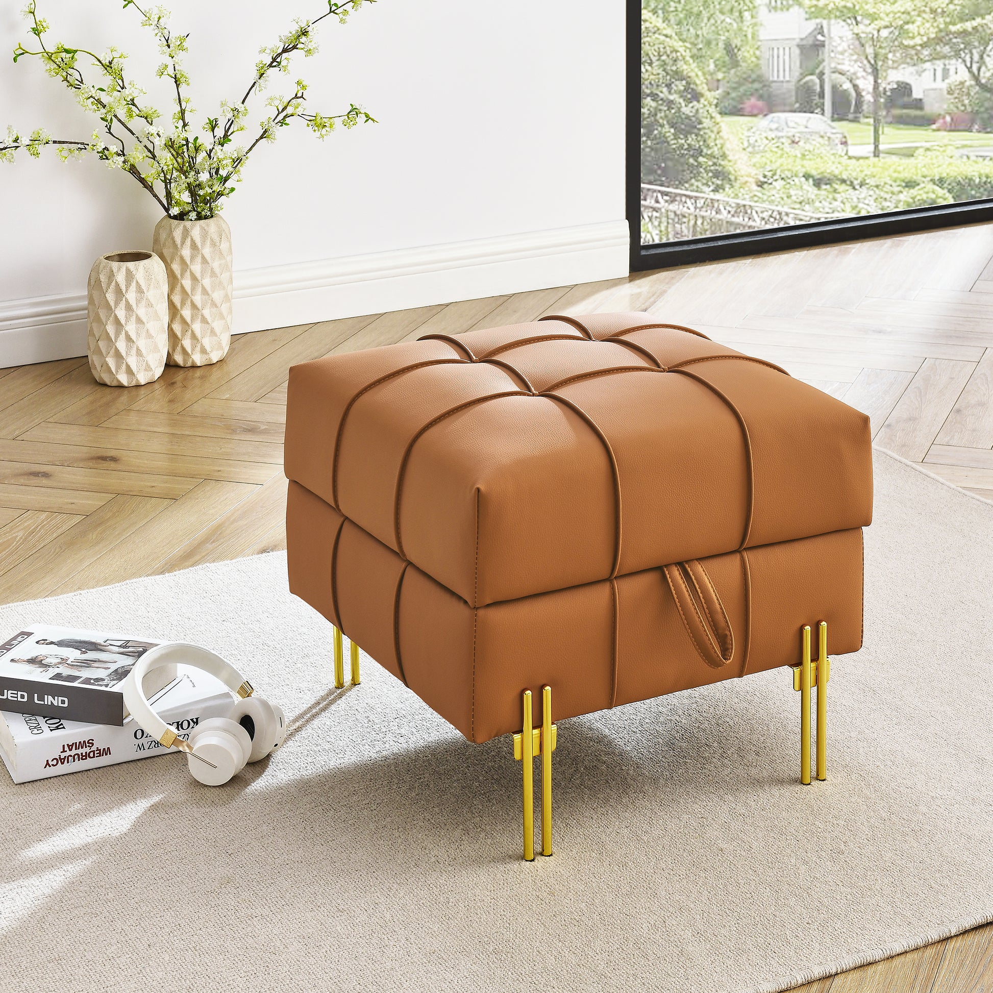 Tan tufted faux leather ottoman with gold hairpin legs perfect for a modern living room