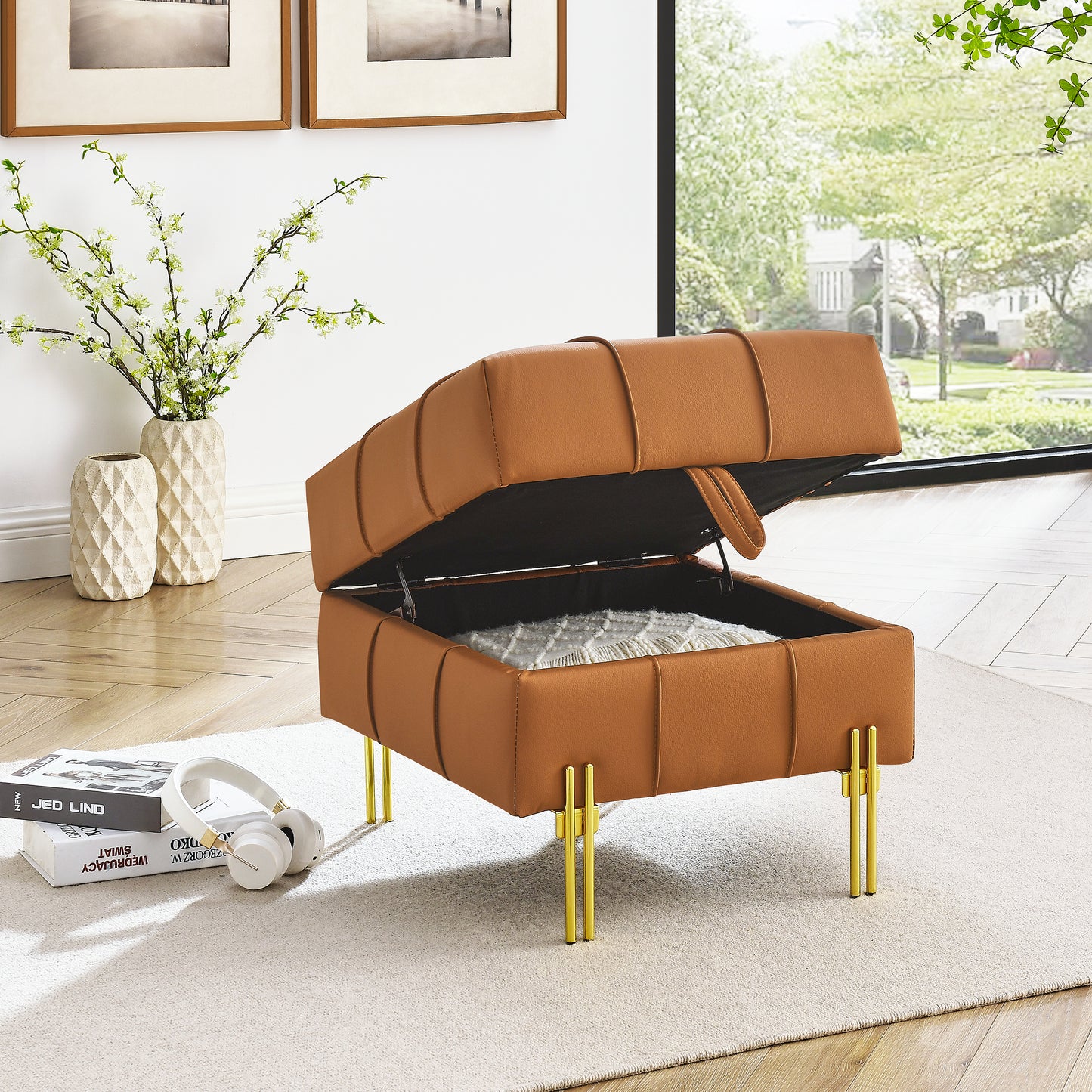 Tan faux leather storage ottoman with tufted detail and gold legs