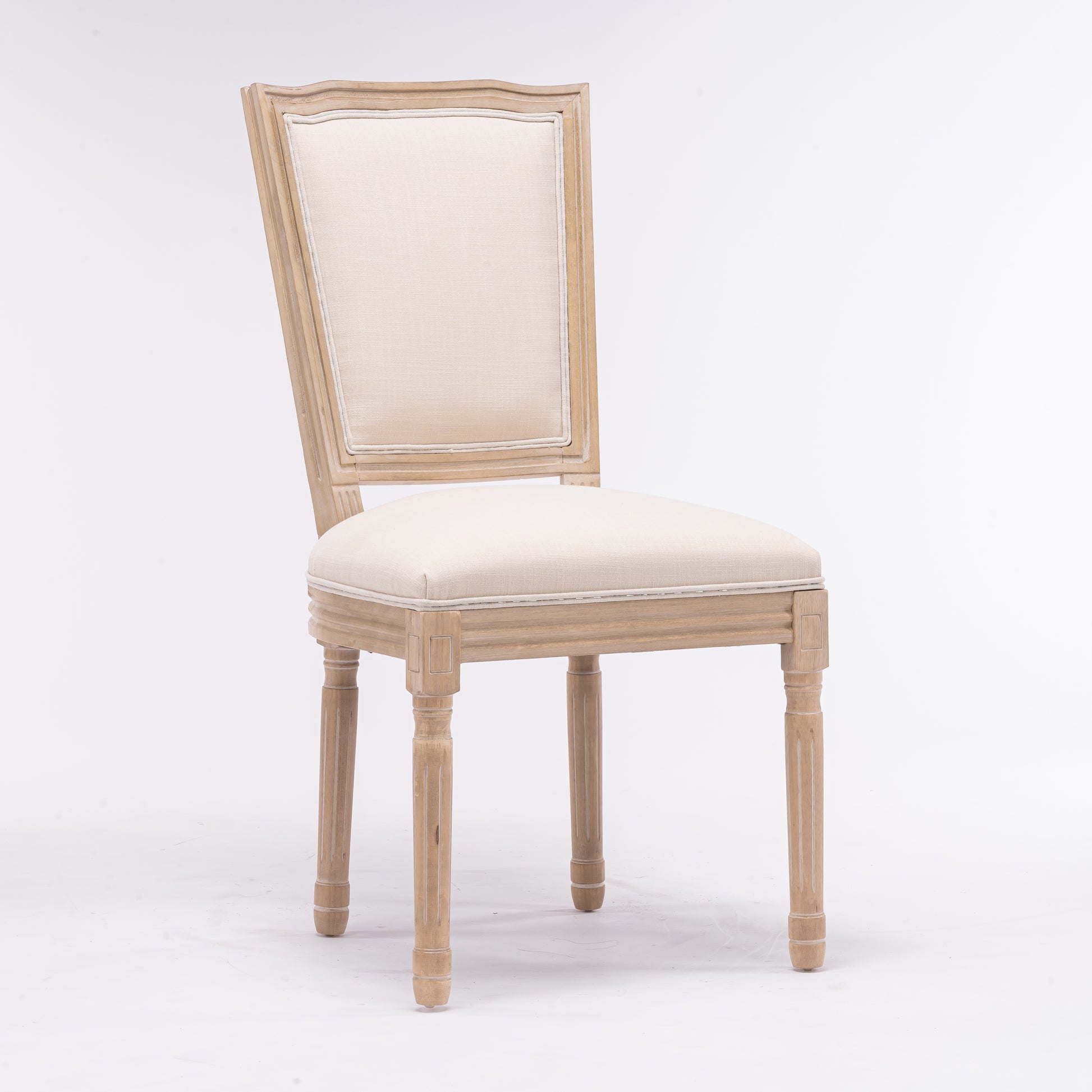 Classic carved wood dining chair with neutral upholstered seat and back