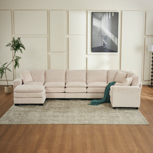 Plush pink corduroy sectional sofa with chaise and scattered cushions for a cozy living room