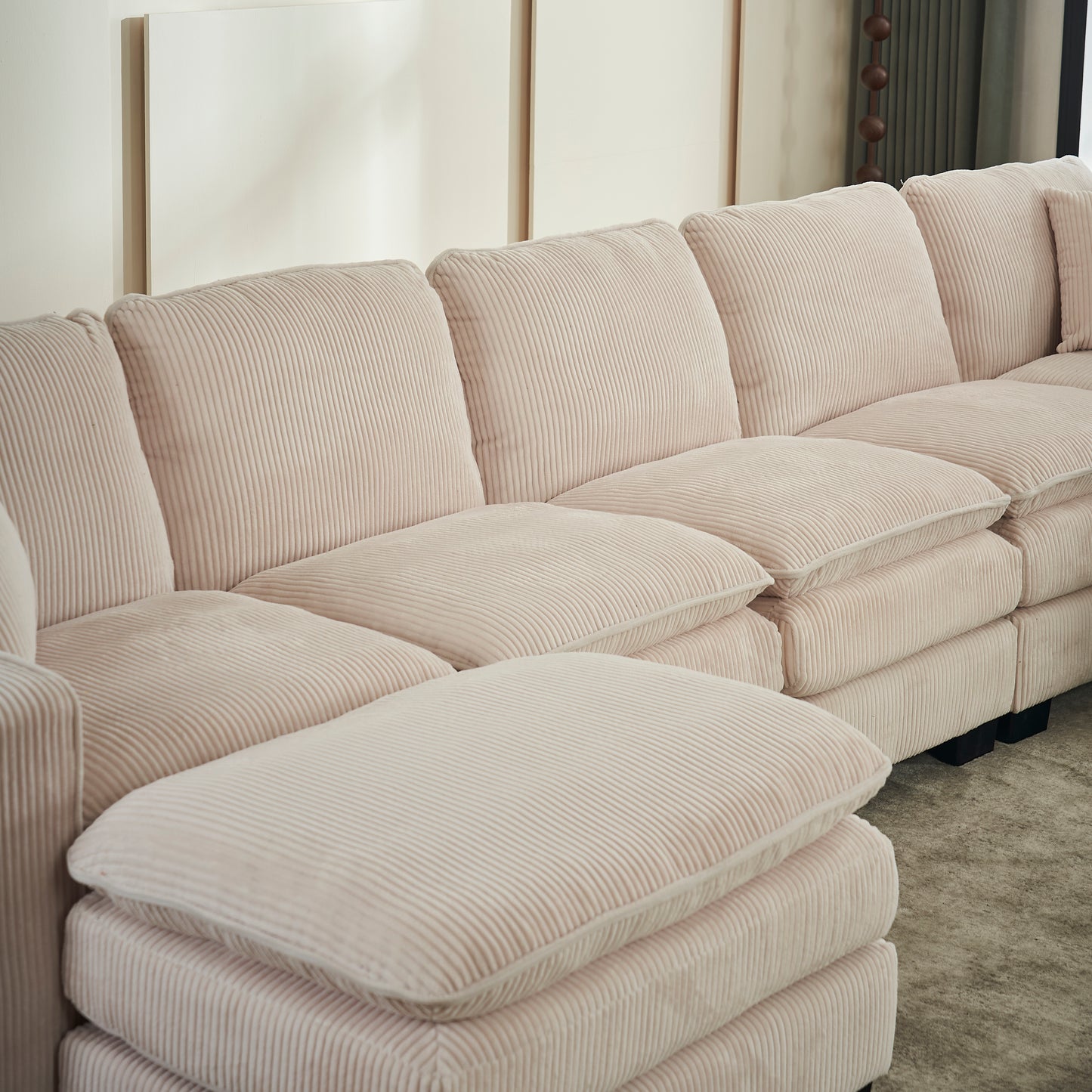 Pale pink corduroy sectional sofa with plush cushions perfect for living rooms