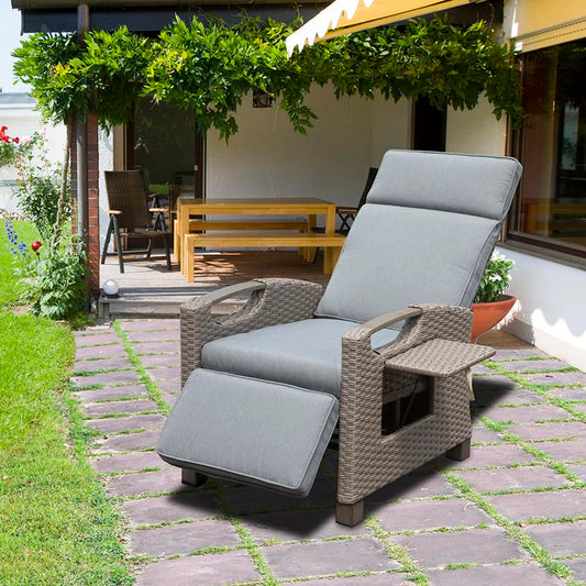 Gray rattan recliner chair with plush cushions and extended footrest