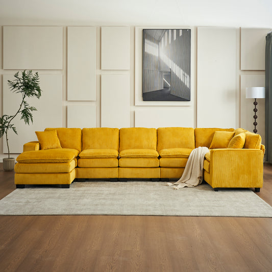 Luxurious mustard yellow corduroy sectional sofa with plush cushions and throw blanket