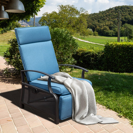 Blue upholstered recliner with metal frame and mesh accents draped with a knitted throw