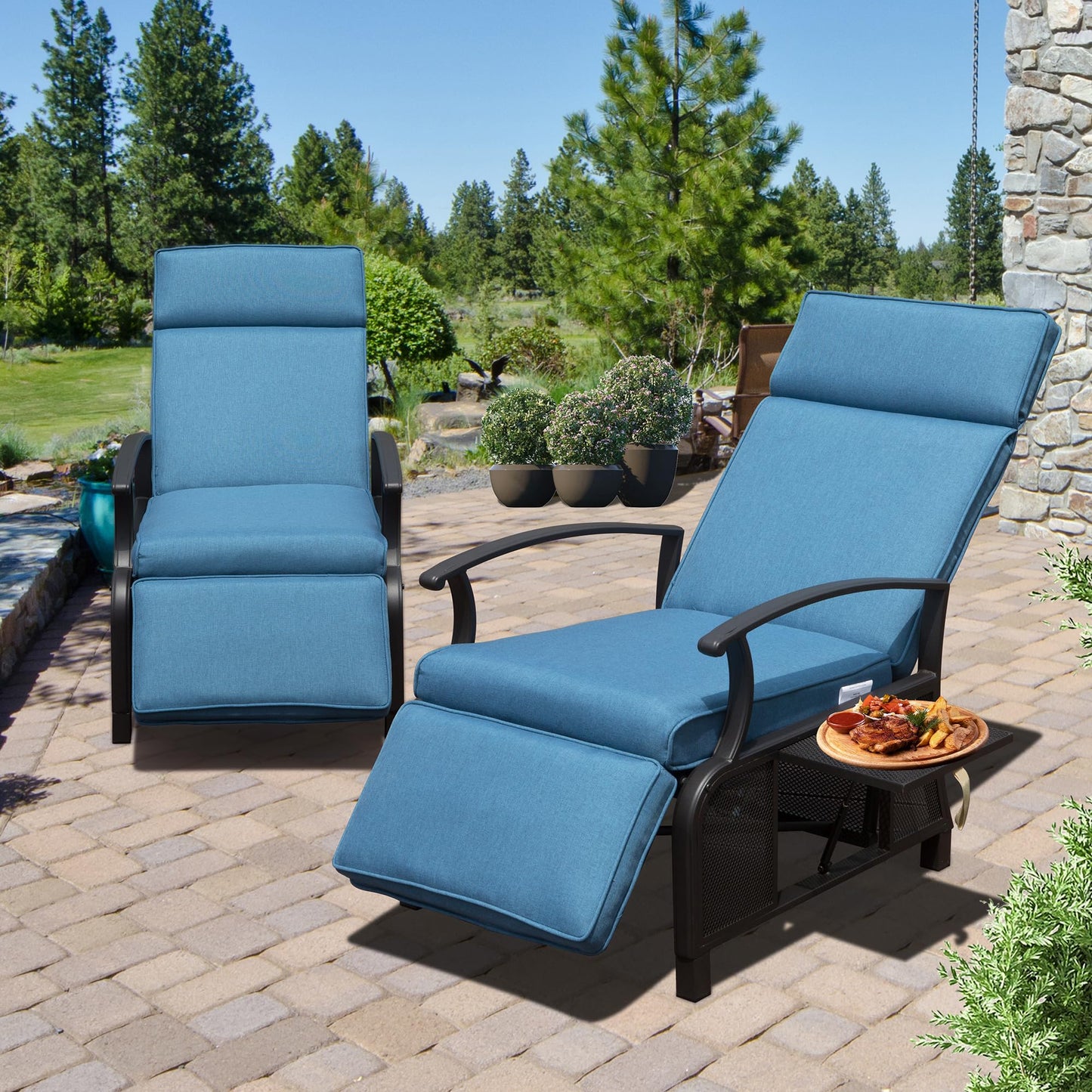 Comfortable blue chaise lounge chairs with adjustable footrests on a stone patio for outdoor relaxation