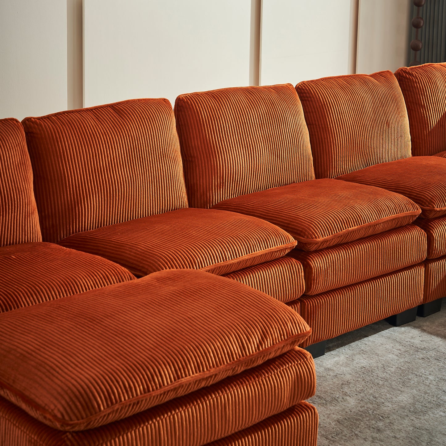 Plush rustcolored corduroy sectional sofa with deep comfortable cushions