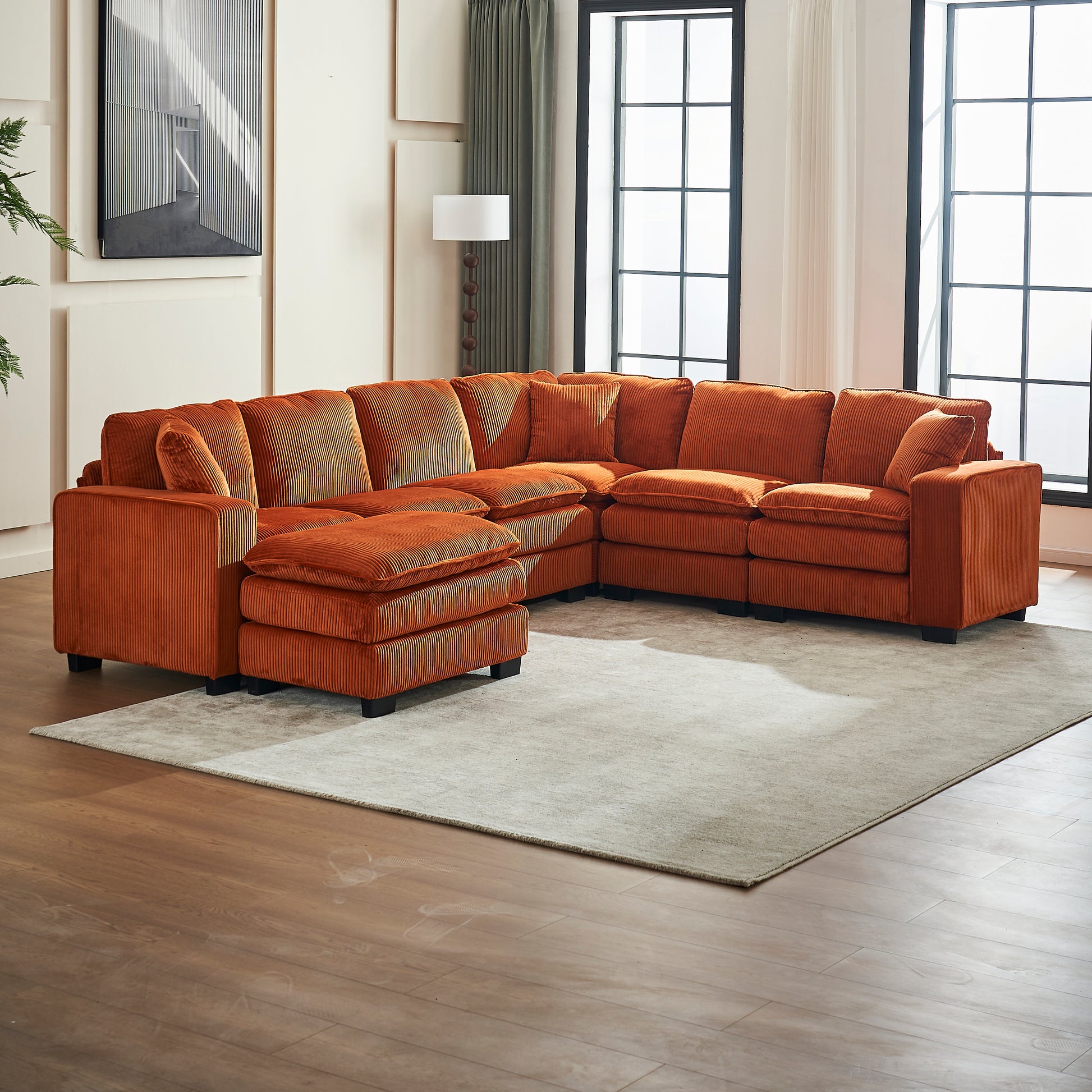 Ornate orange corduroy sectional sofa with plush cushions and ottoman for living room comfort