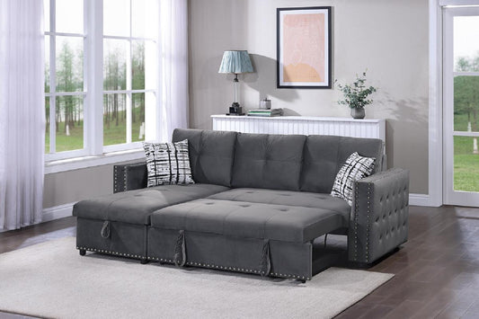 Dark gray velvet sectional sofa with pullout chaise and hidden storage tufted arms and decorative nailhead trim