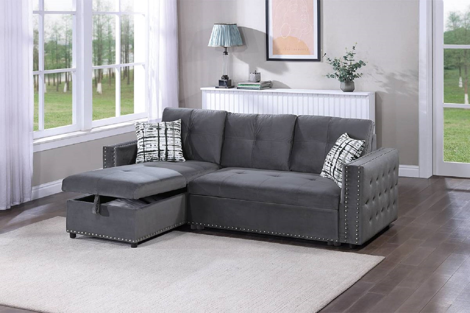 Dark gray velvet sectional sofa with tufted details and nailhead trim perfect for living rooms