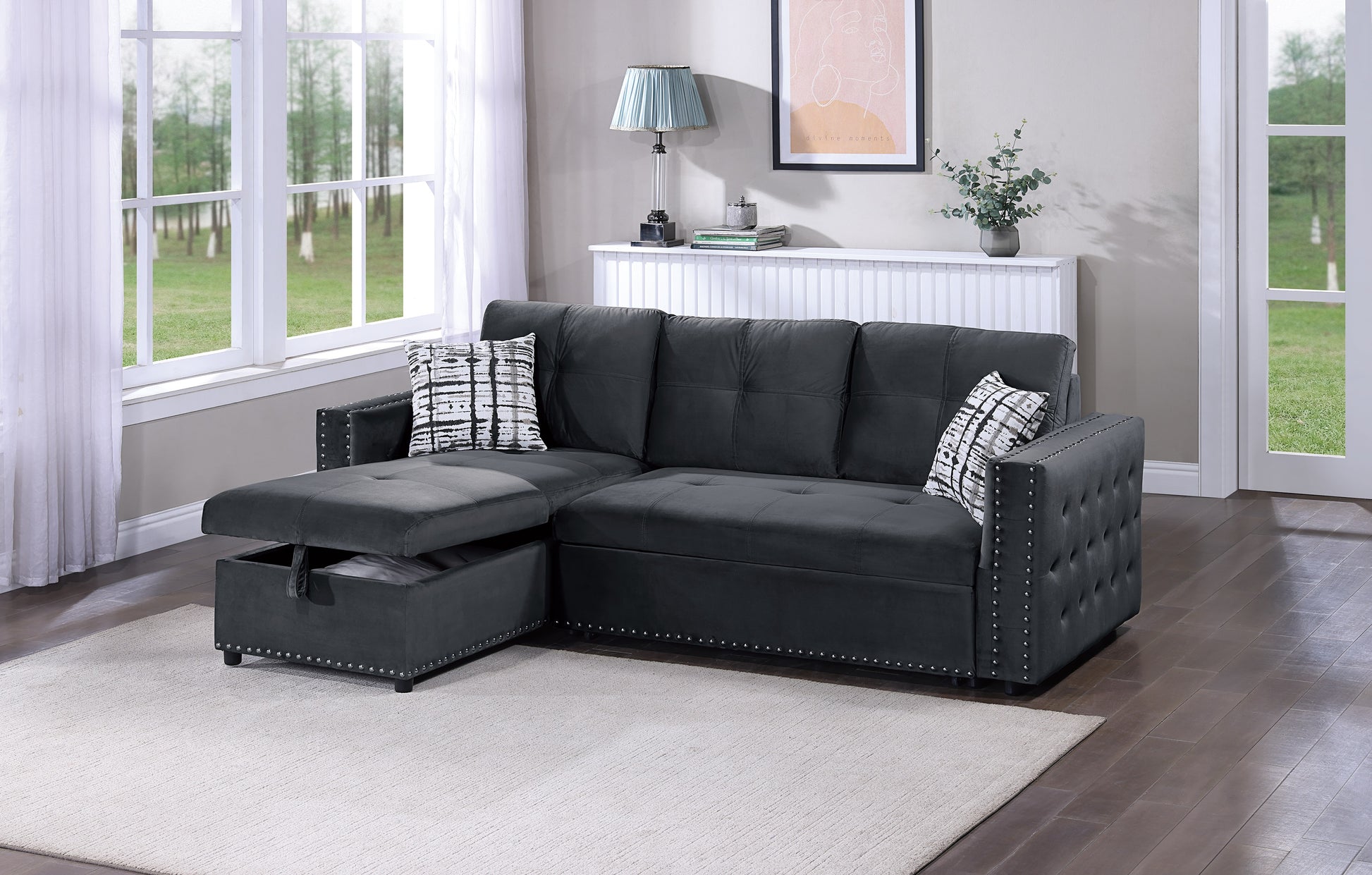 Dark grey velvet sectional sofa with storage chaise and decorative nailhead trim