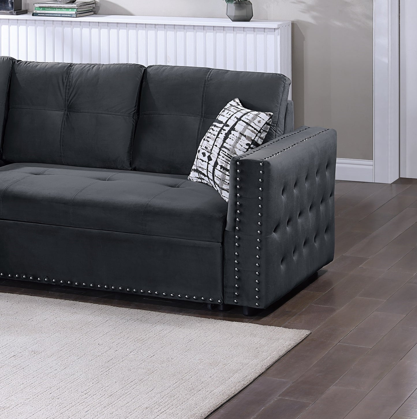 Dark grey velvet sectional sofa with silver nailhead trim perfect for a living room