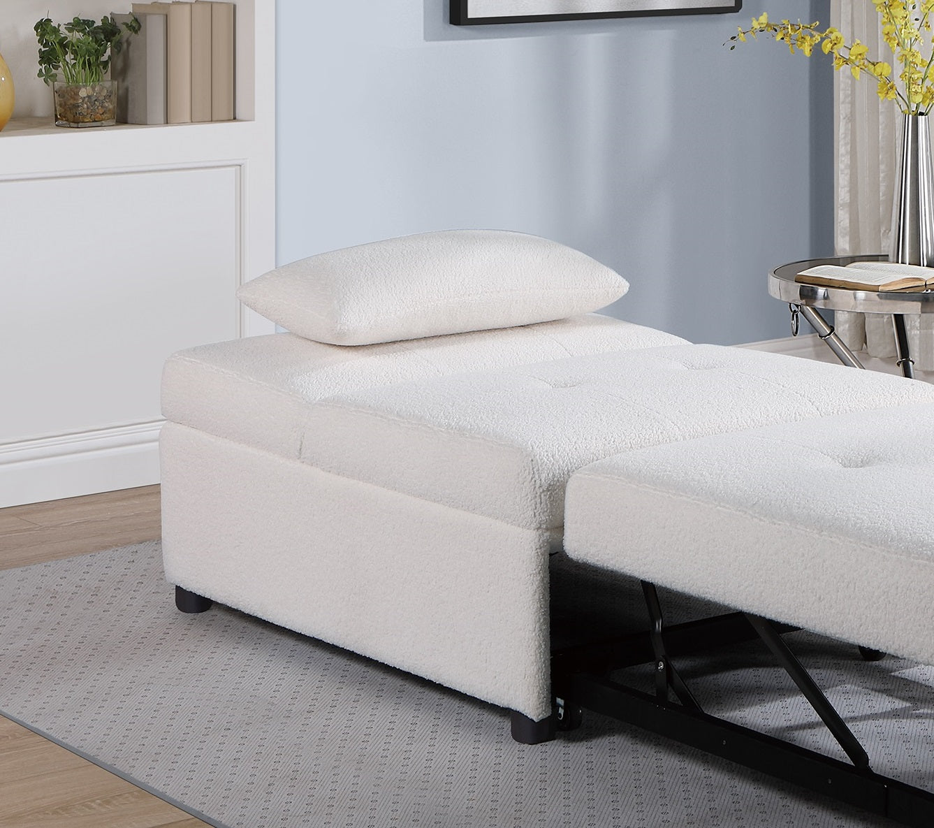 White boucl sofa bed with ottoman extended featuring tufted seat cushions
