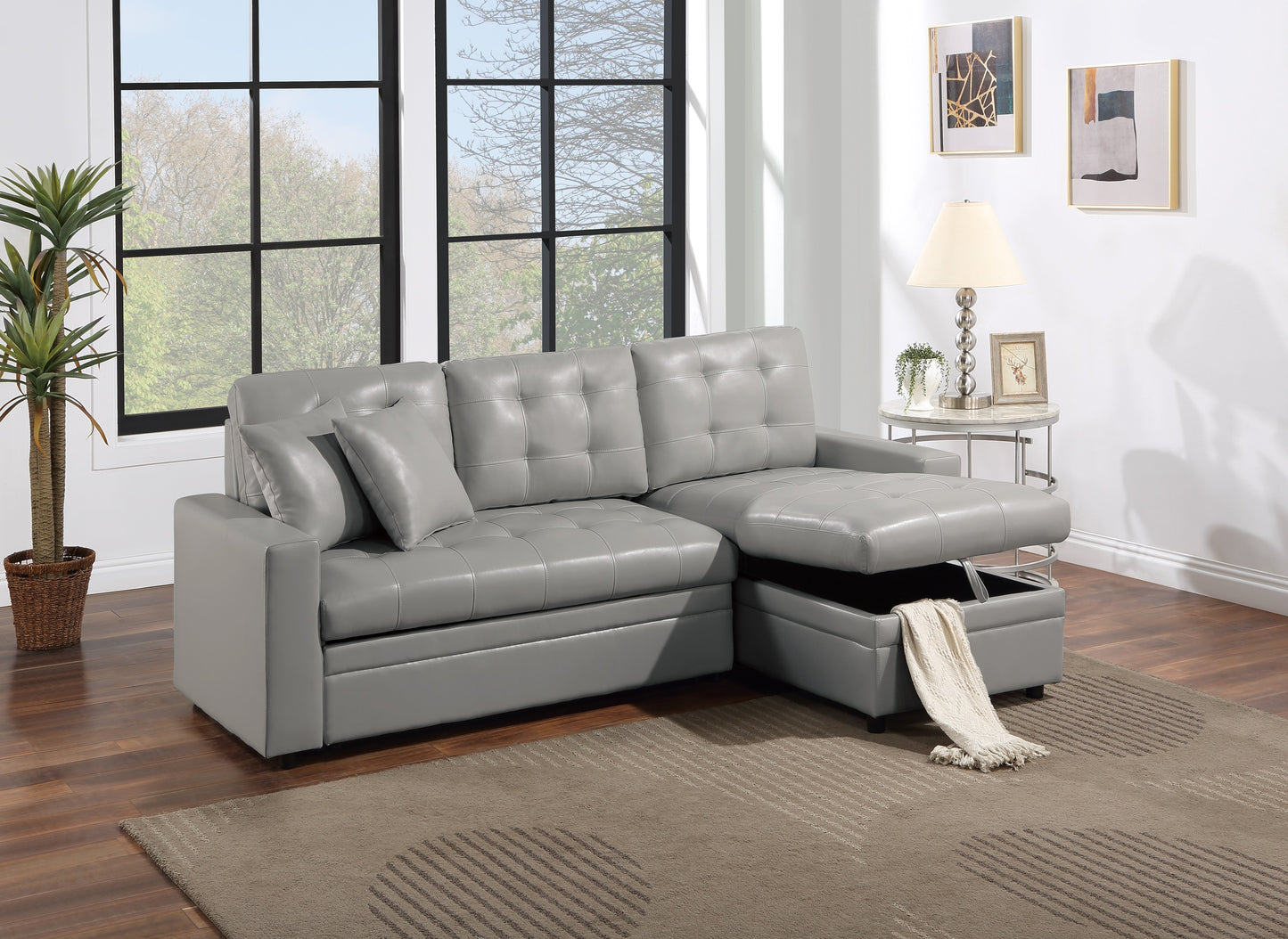 Gray faux leather sectional sofa with tufted cushions and hidden storage