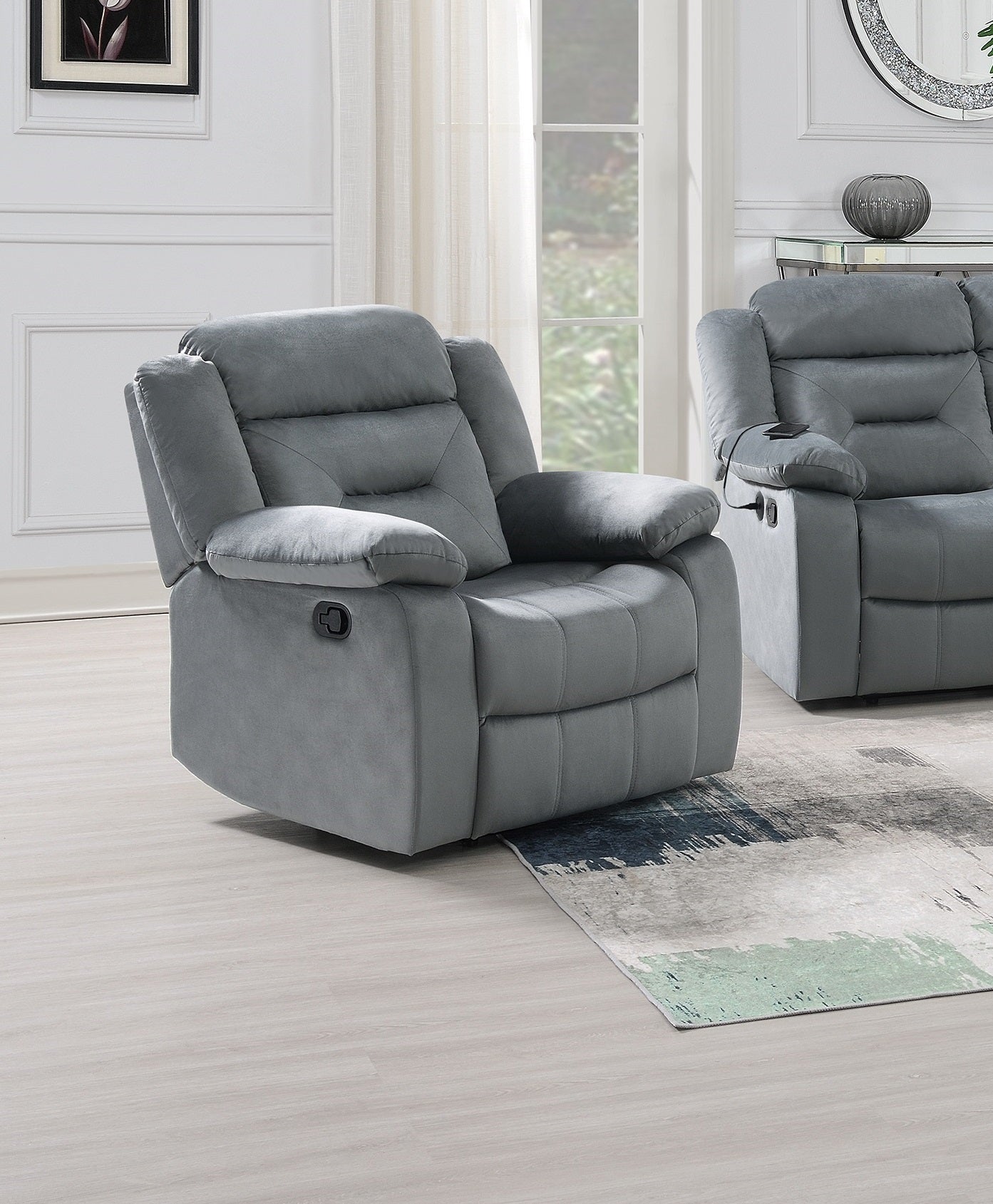Gray plush recliner with padded arms and lumbar support featuring a USB port for charging devices