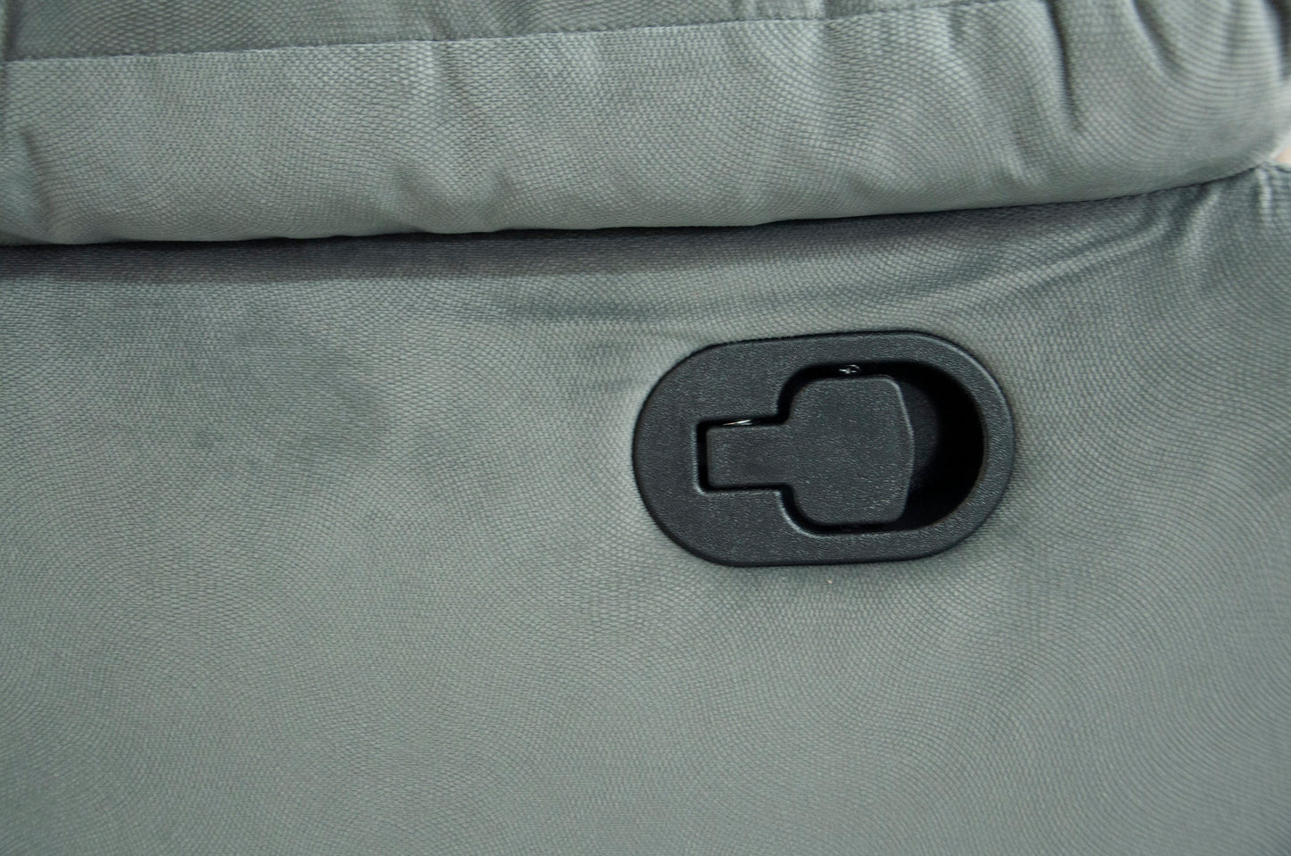 Gray recliner fabric with black plastic release lever for reclining mechanism