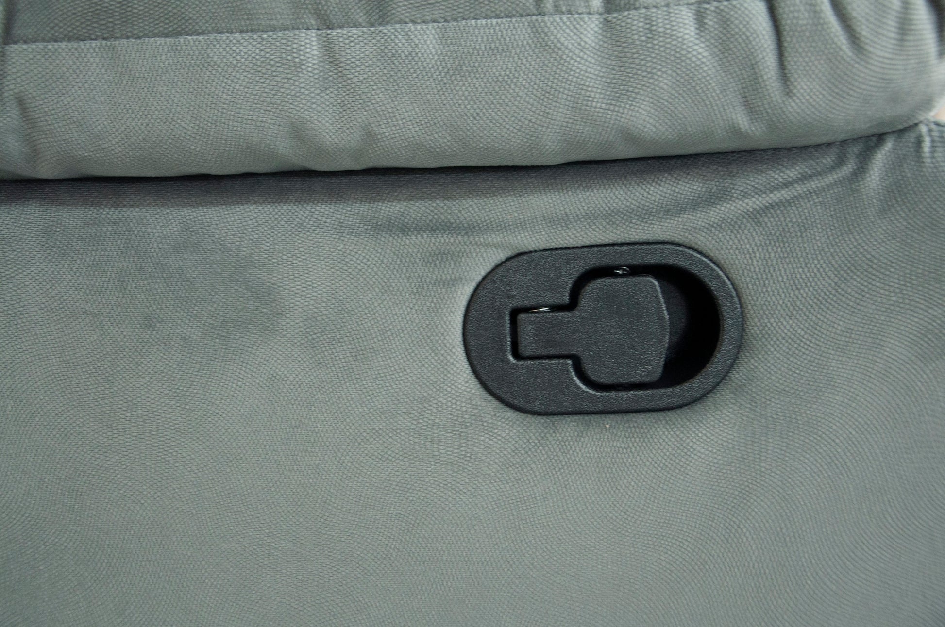 Gray recliner fabric with black plastic release lever for reclining mechanism