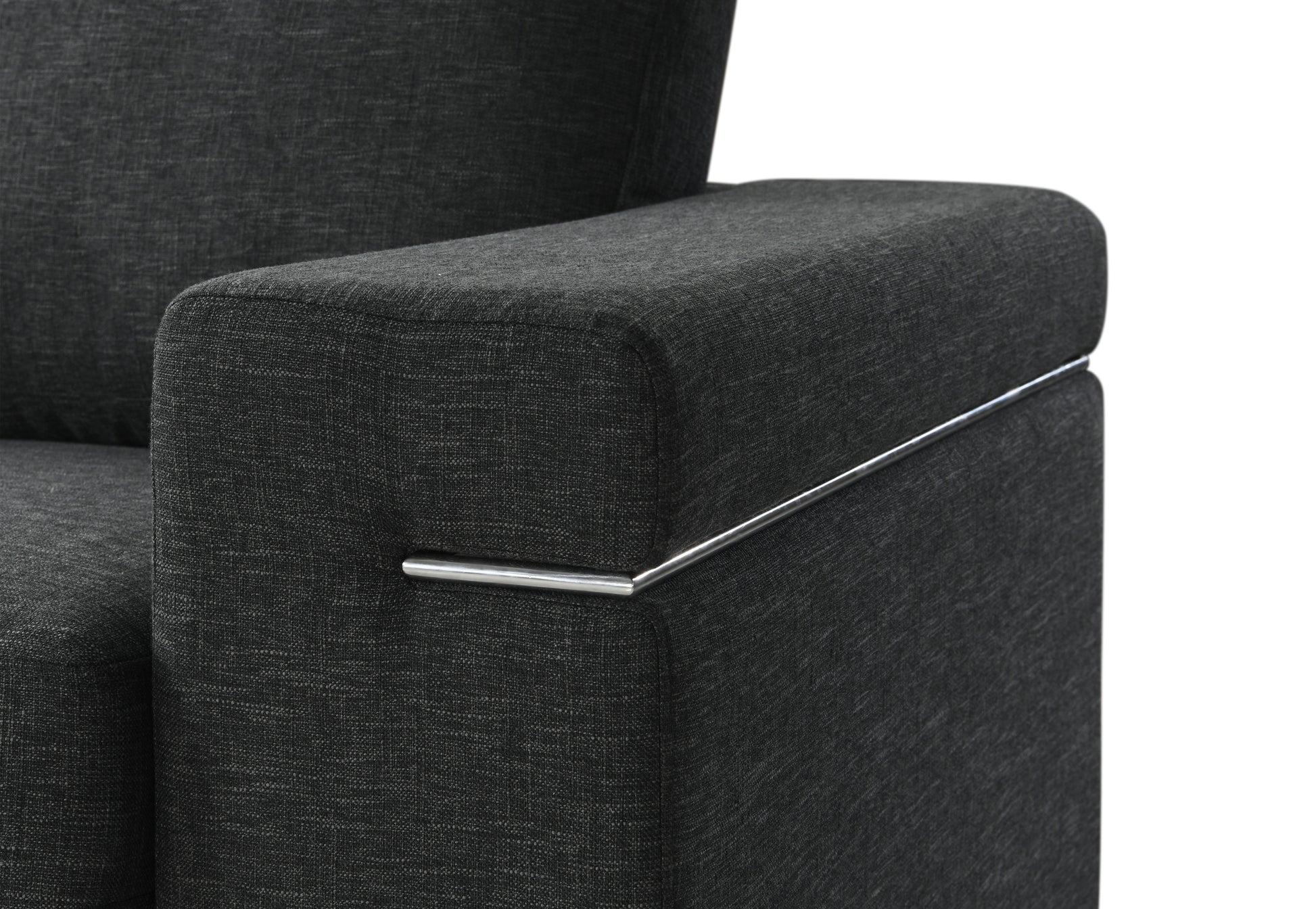 Closeup of a charcoal grey fabric armchair armrest with a sleek chrome accent strip
